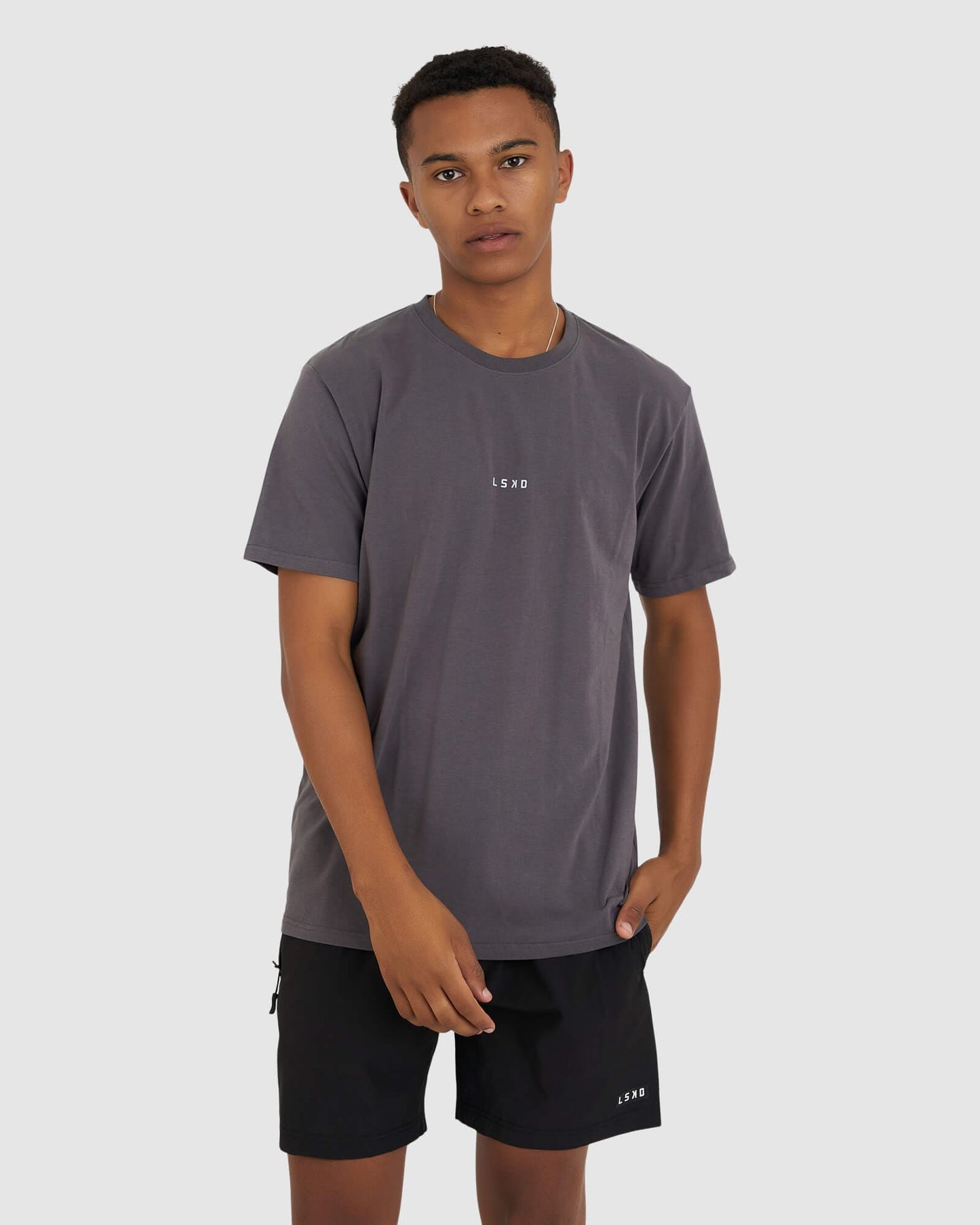 Model wearing Base Tee - Shadow