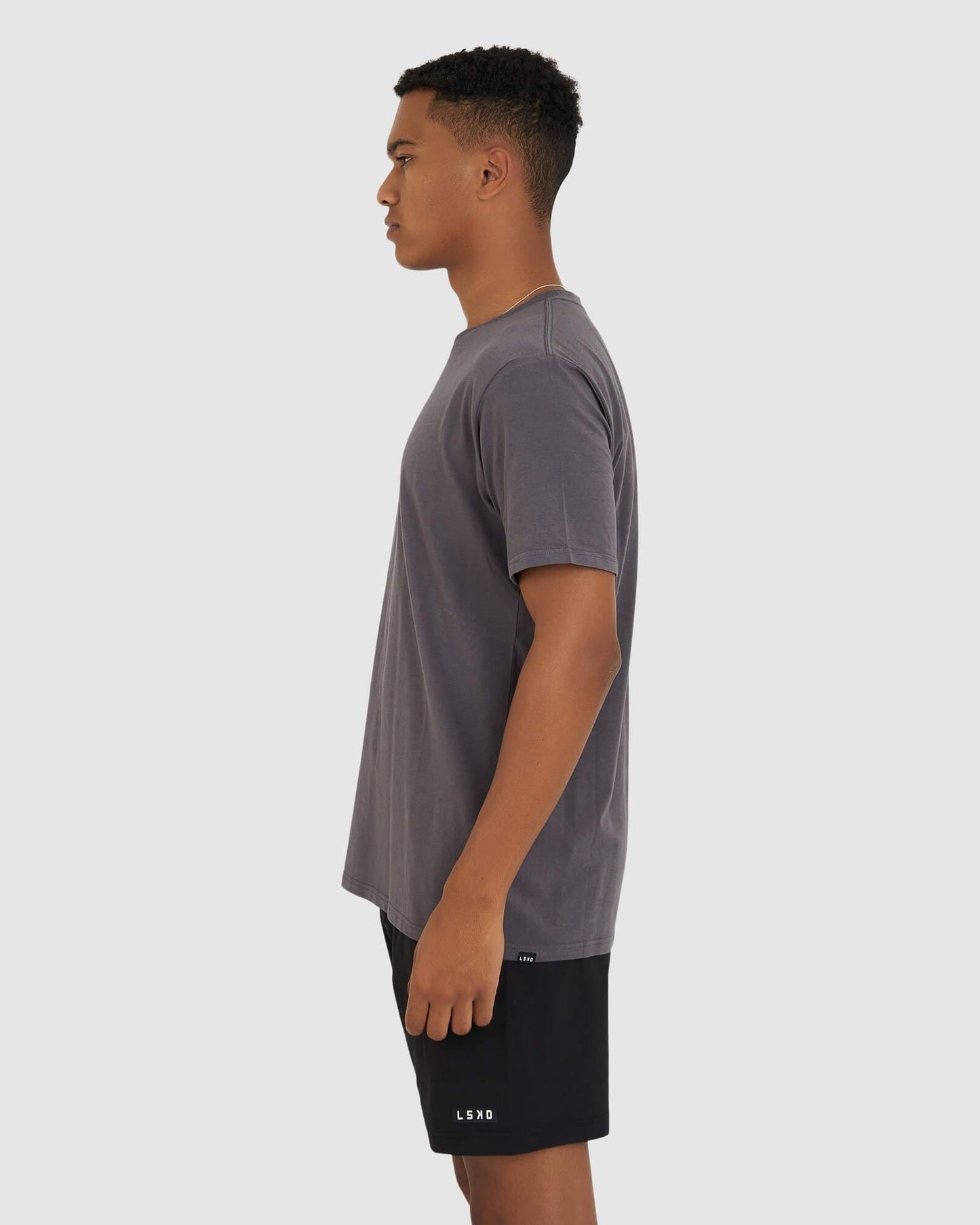 Model wearing Base Tee - Shadow