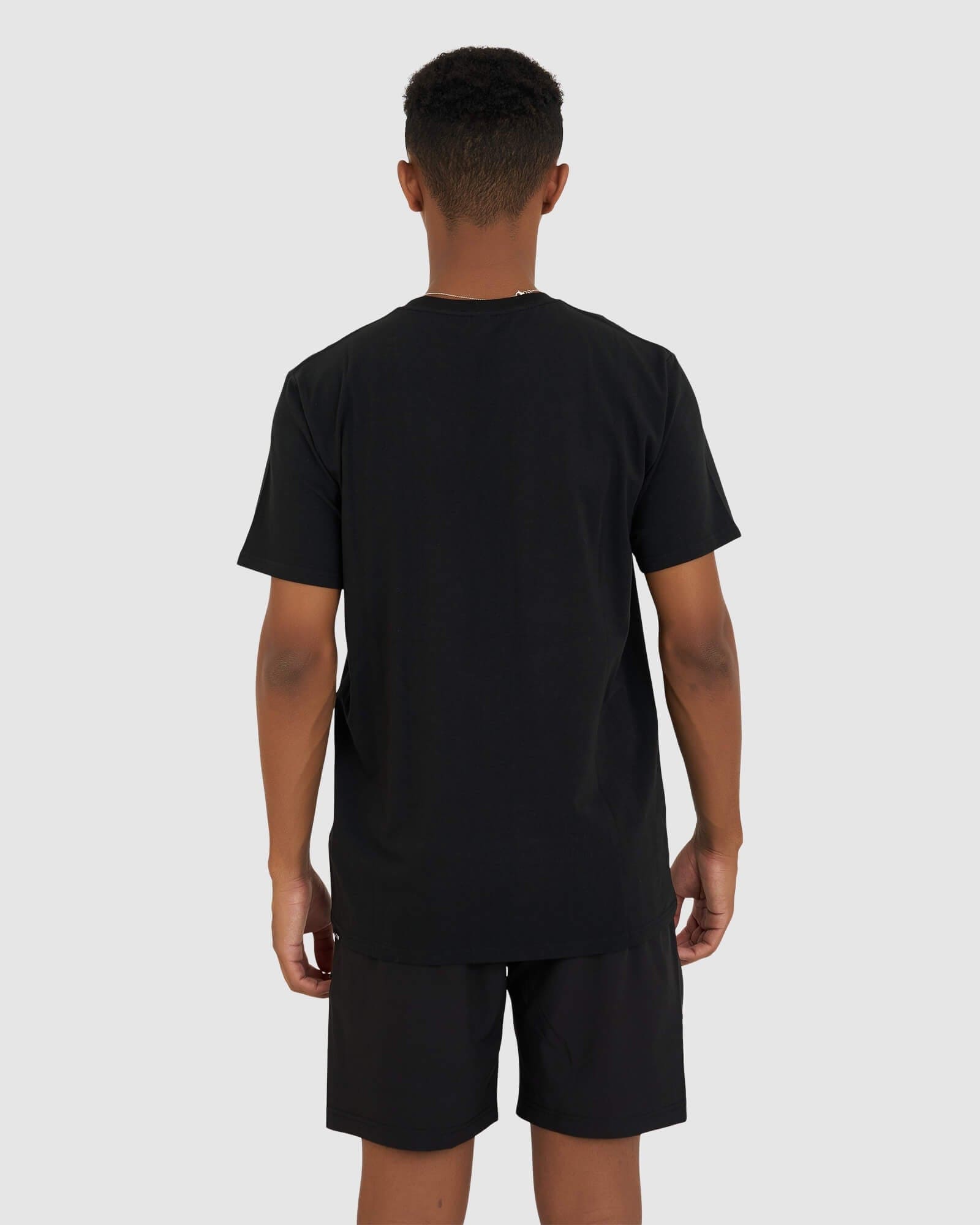 Model wearing Base Tee - Black