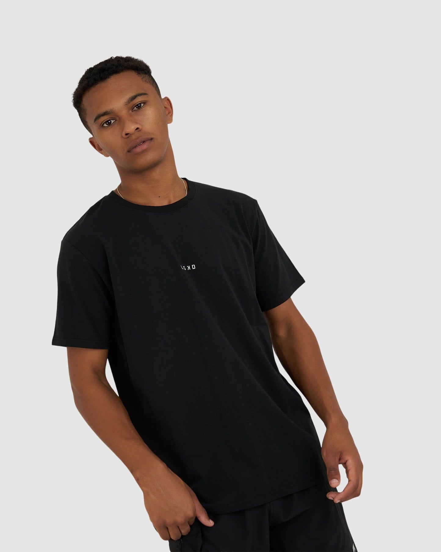 Model wearing Base Tee - Black