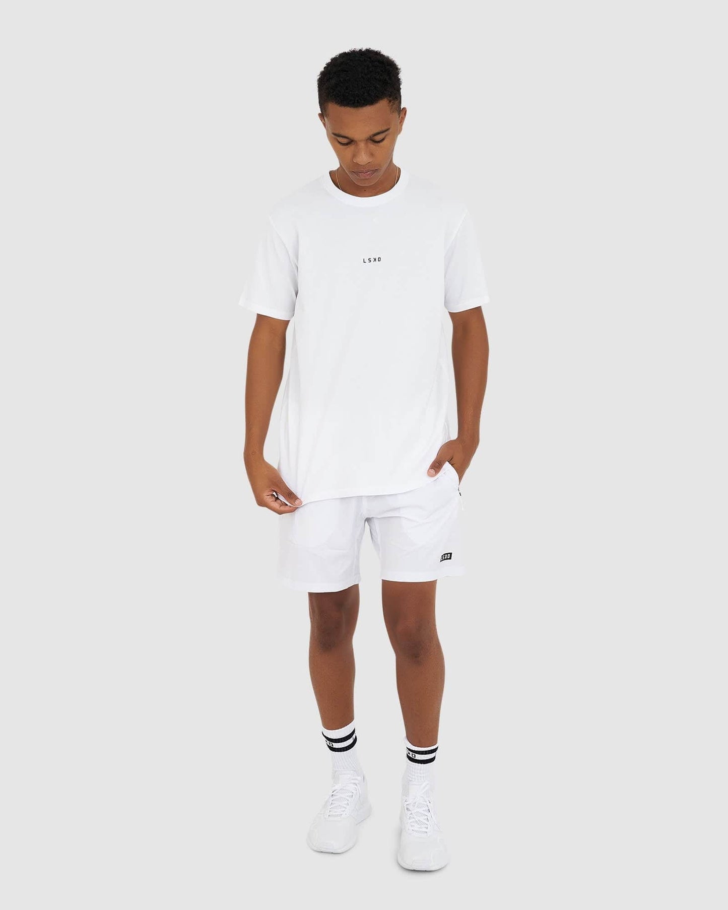 Model wearing Base Tee - White
