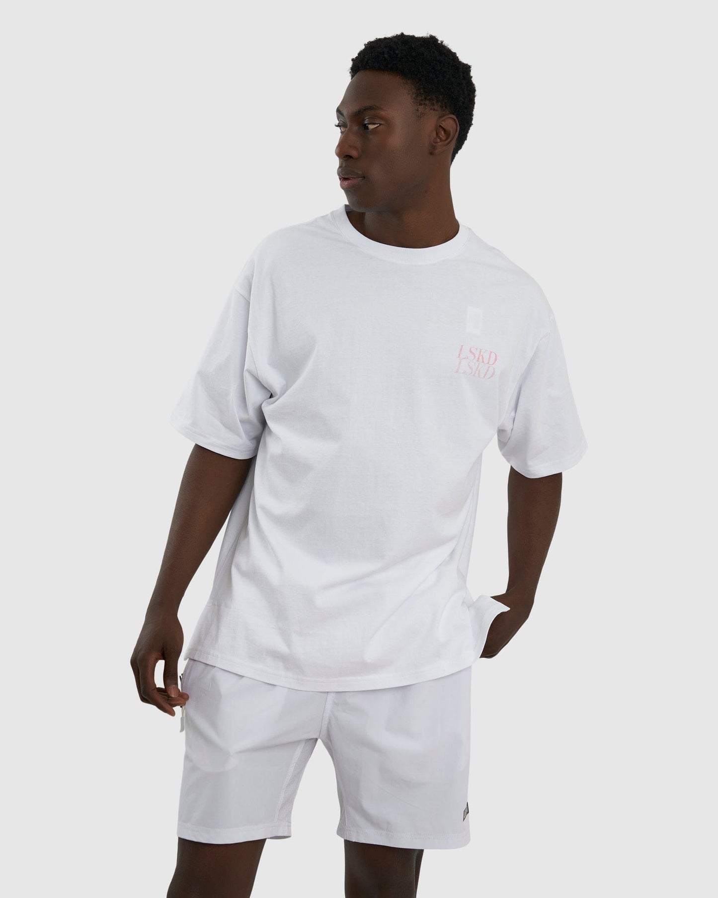 Model wearing Aurora Tee Oversized - White