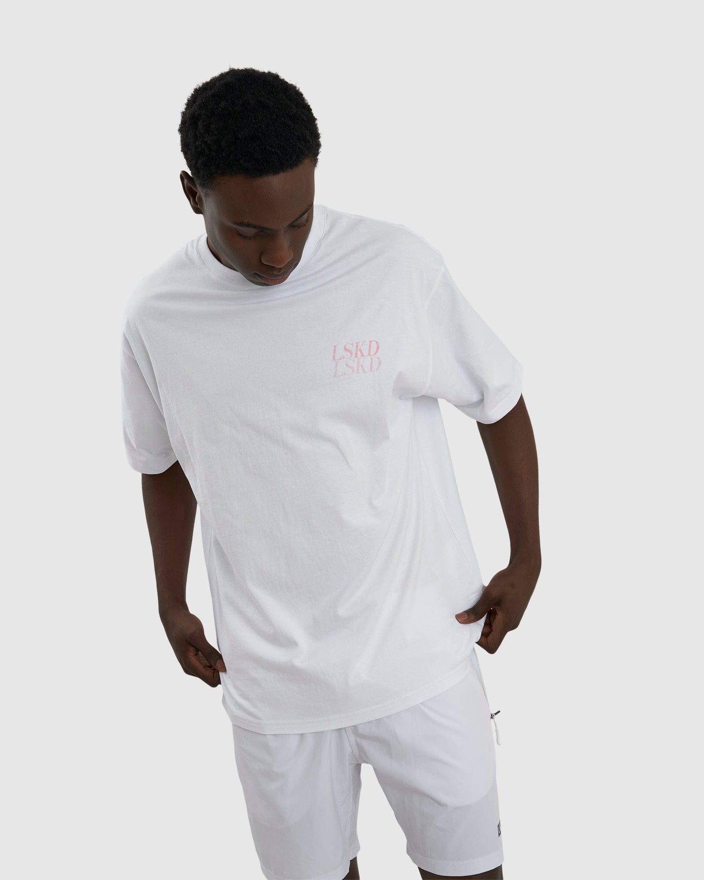 Model wearing Aurora Tee Oversized - White