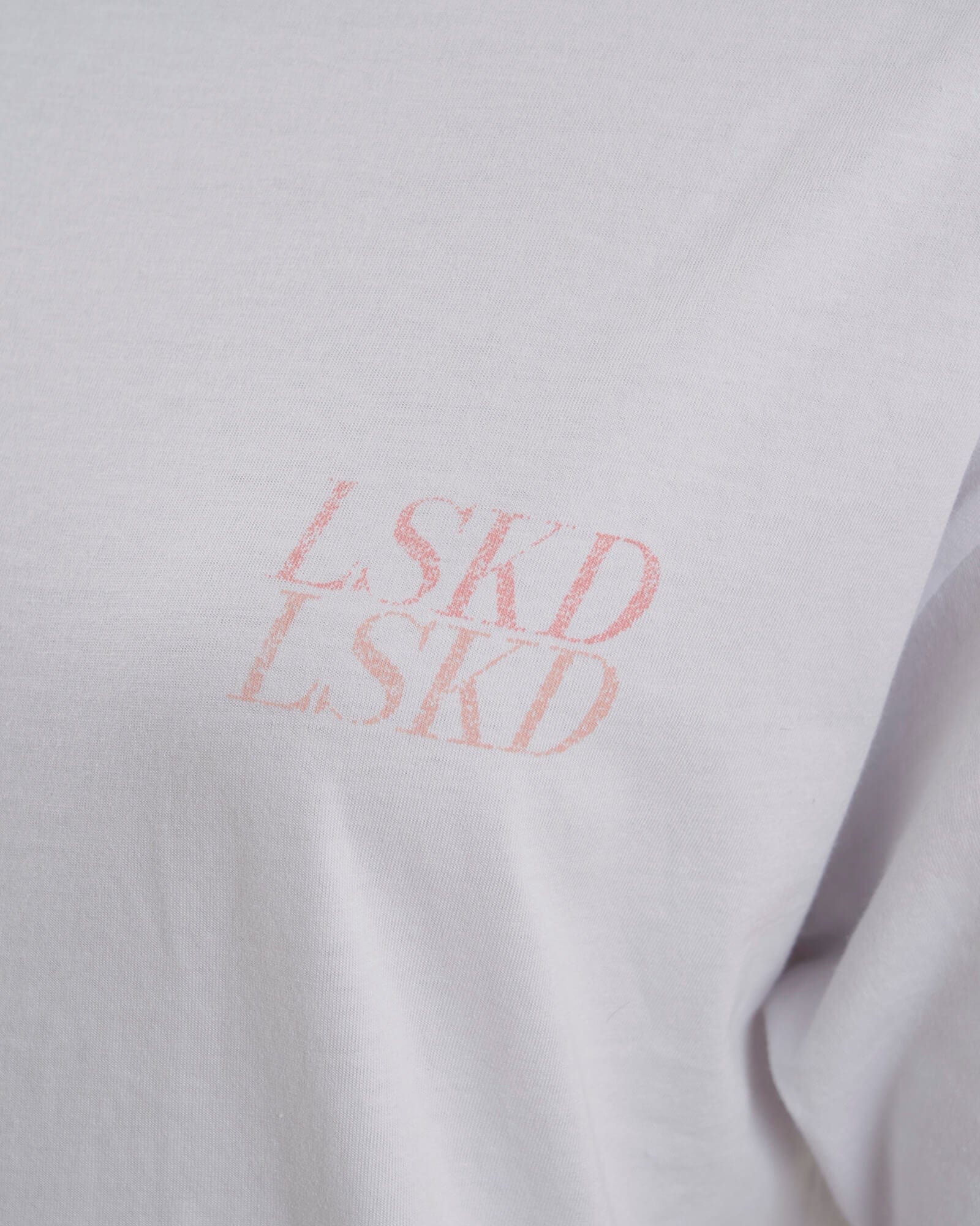 Model wearing Aurora Tee Oversized - White