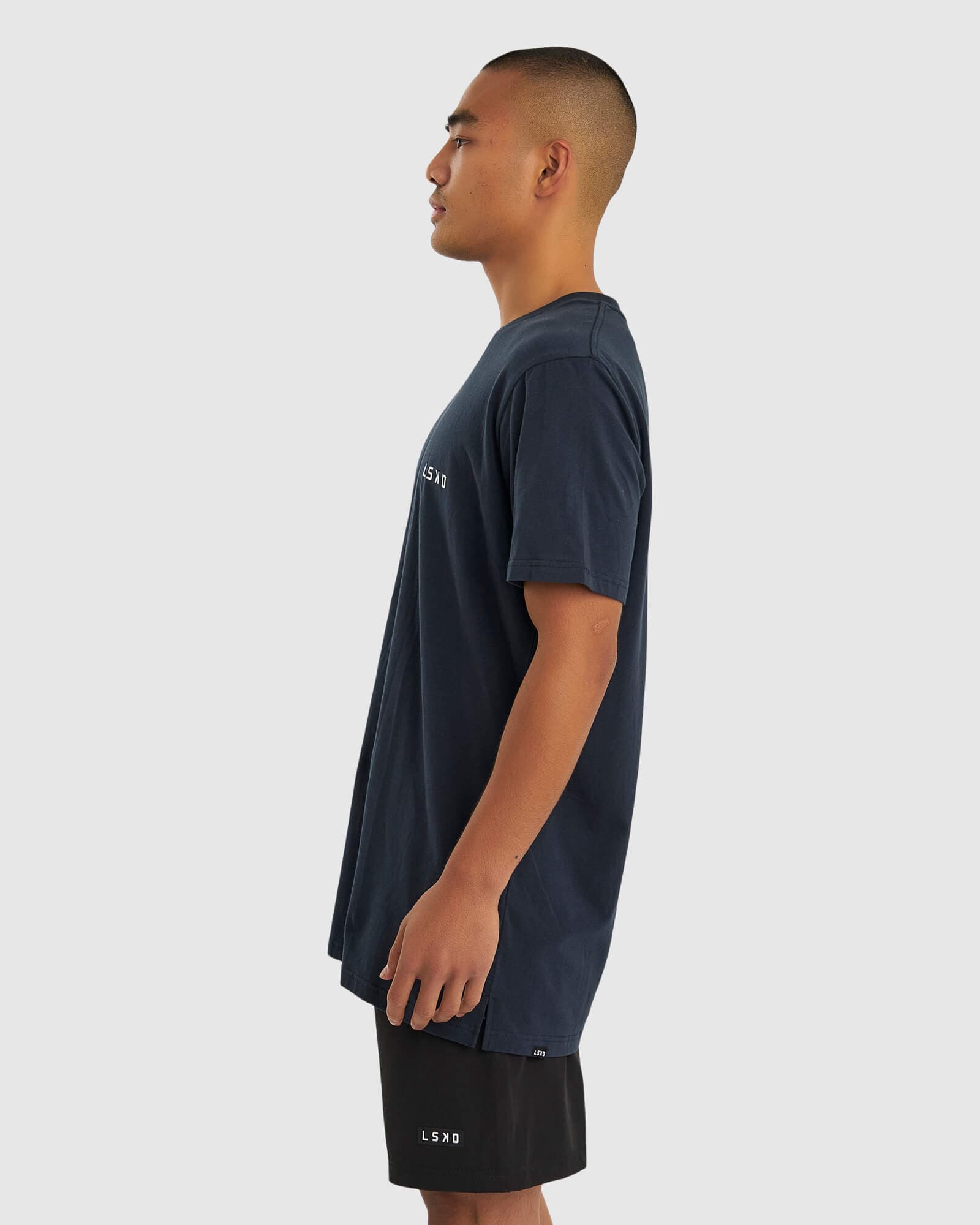 Model wearing Form Tee - Carbon