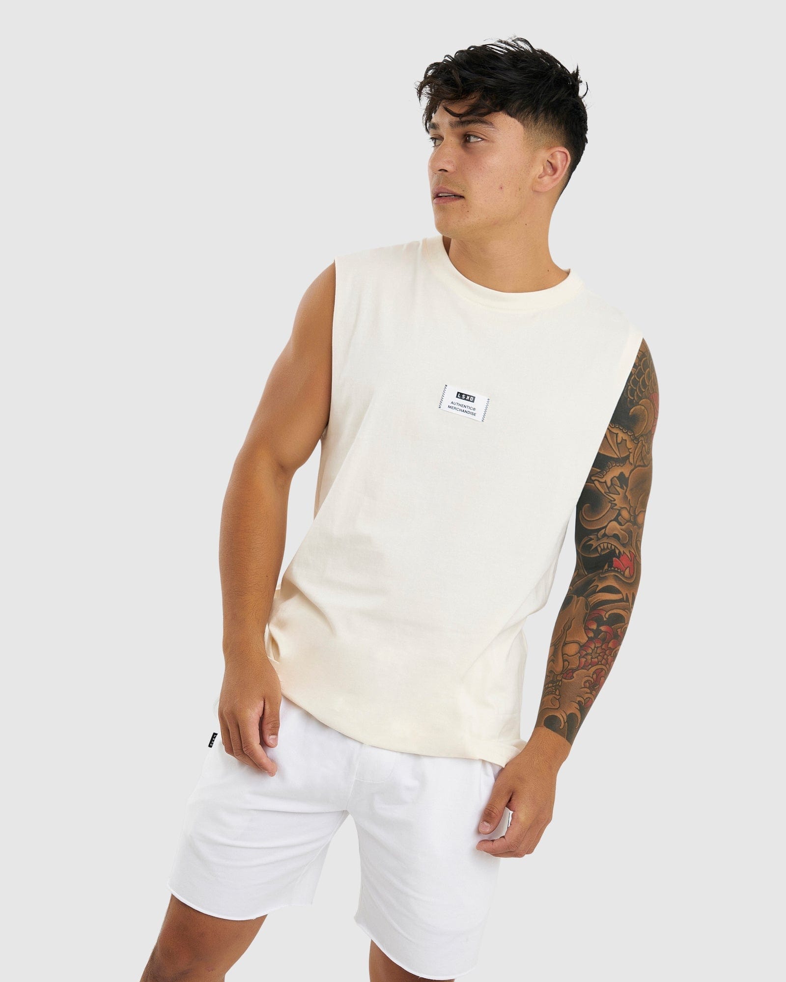 Model wearing Merch Tank Vintage Fit - Cream