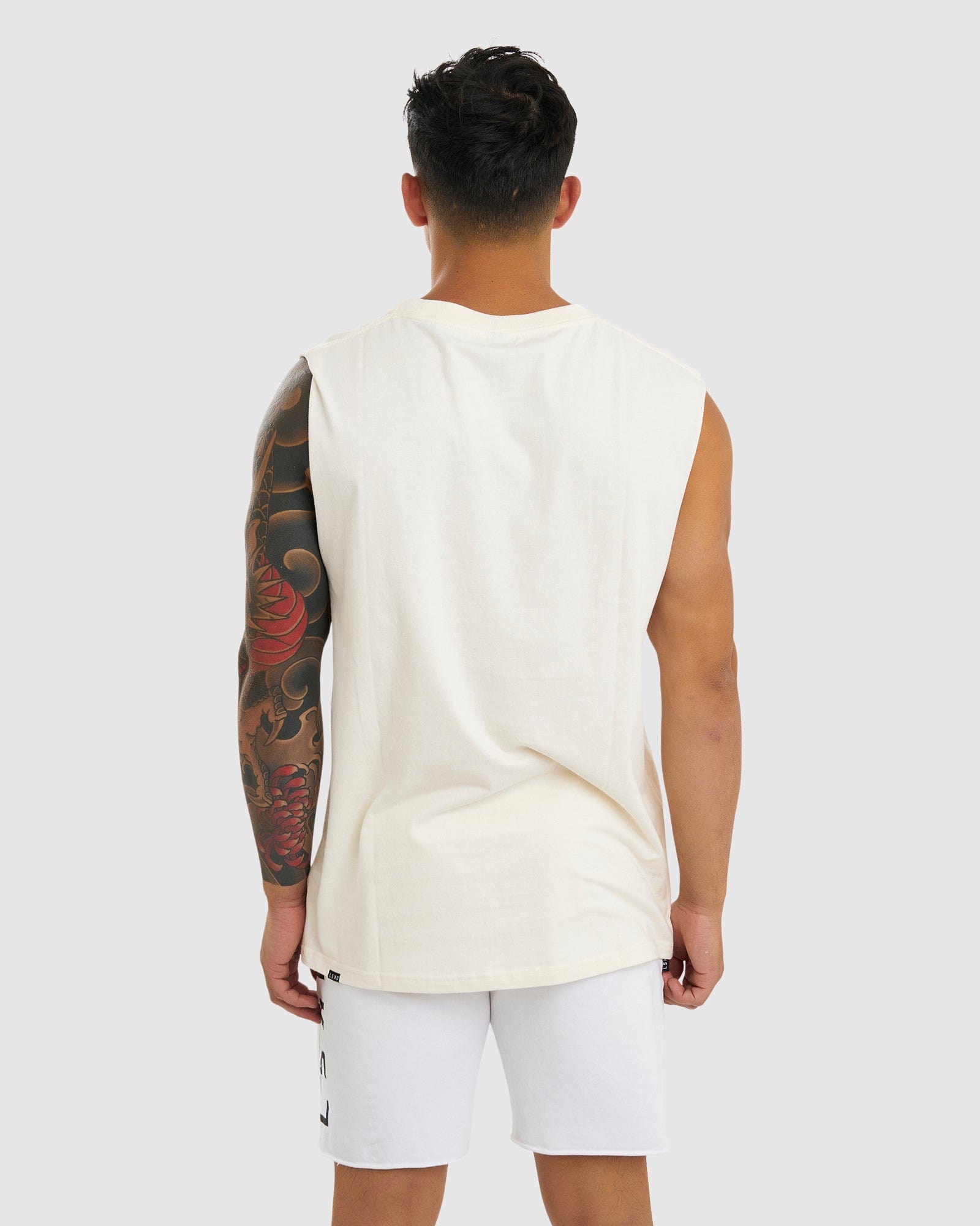Model wearing Merch Tank Vintage Fit - Cream