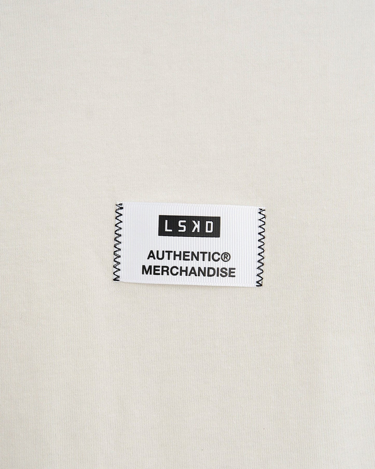 Model wearing Merch Tank Vintage Fit - Cream