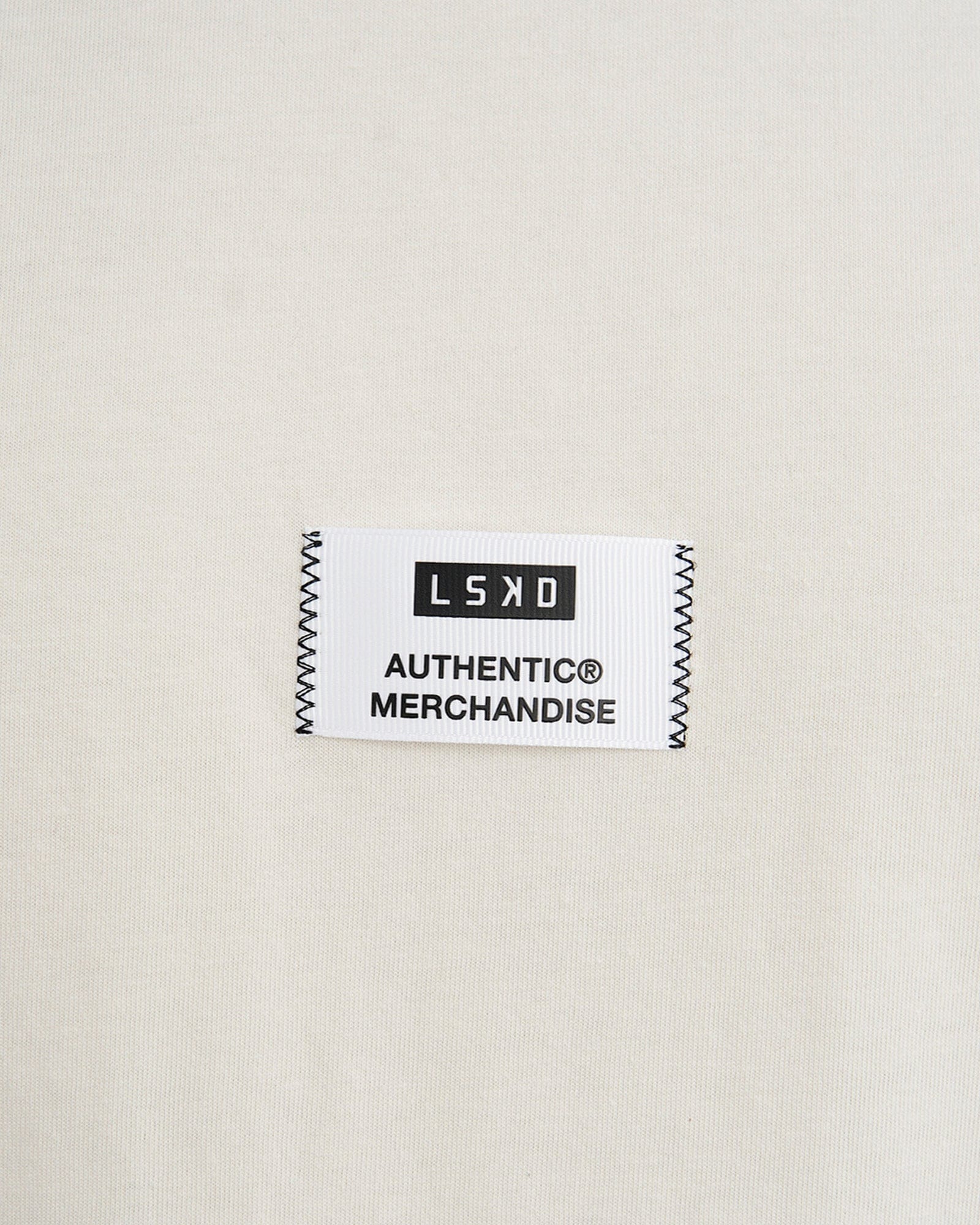 Model wearing Merch Tank Vintage Fit - Cream