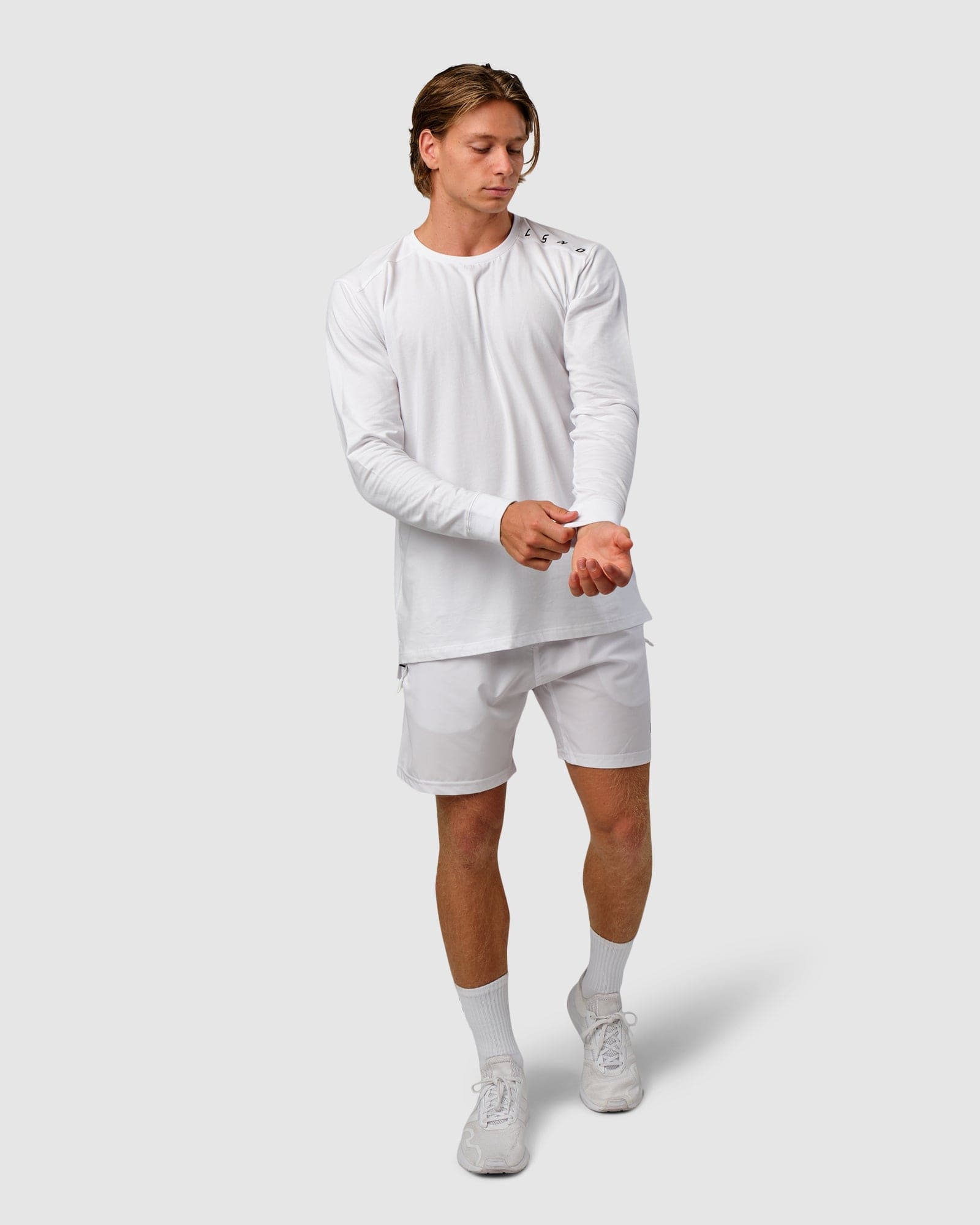 Model wearing Competitor LS Tee - White