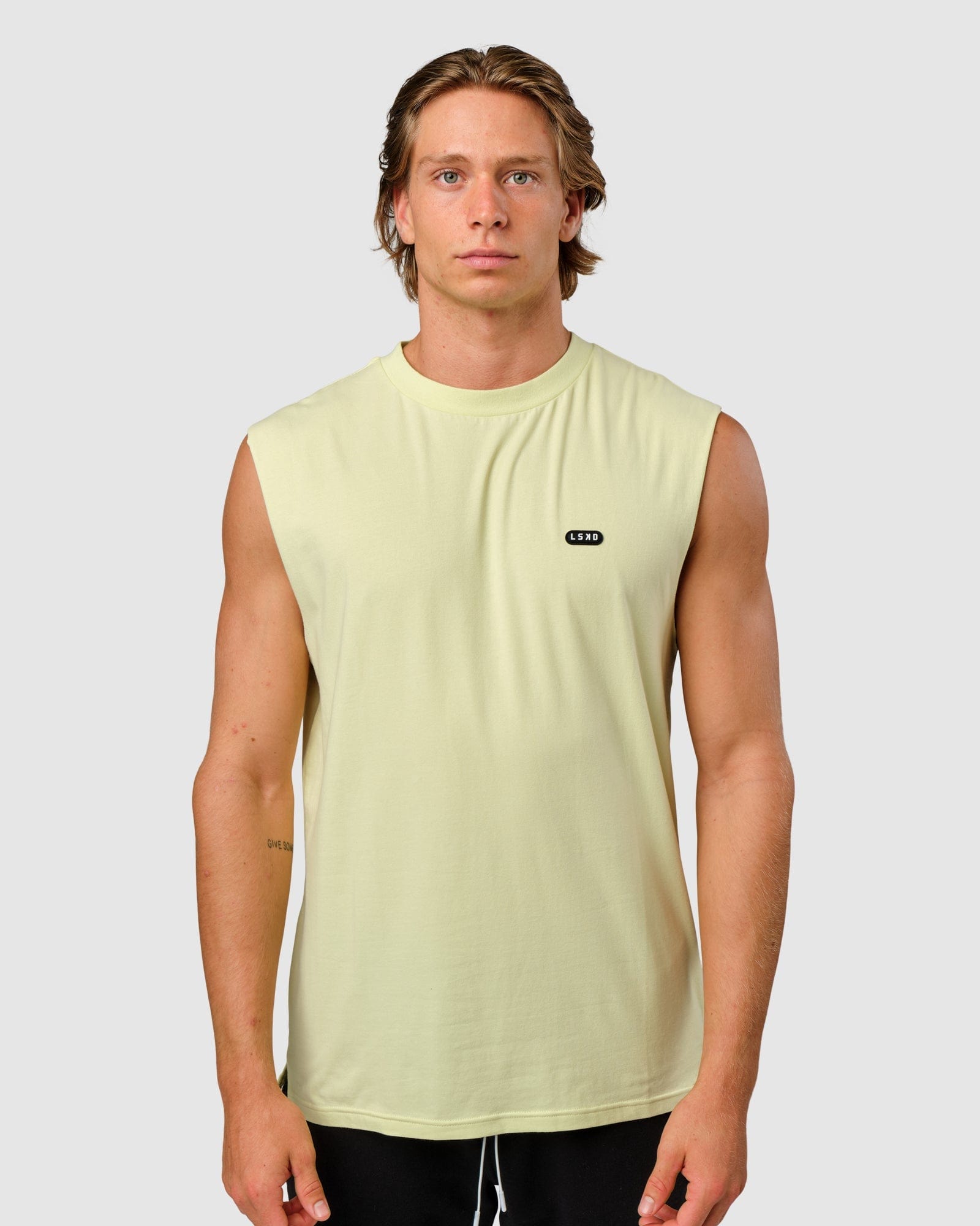 Model wearing Capsule Tank Oversize - Pastel Lime