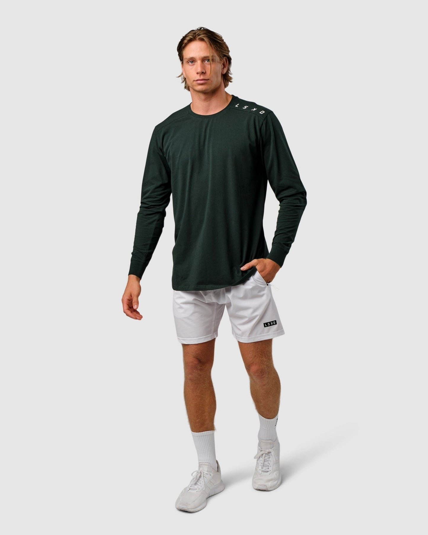 Model wearing Competitor LS Tee - Forest