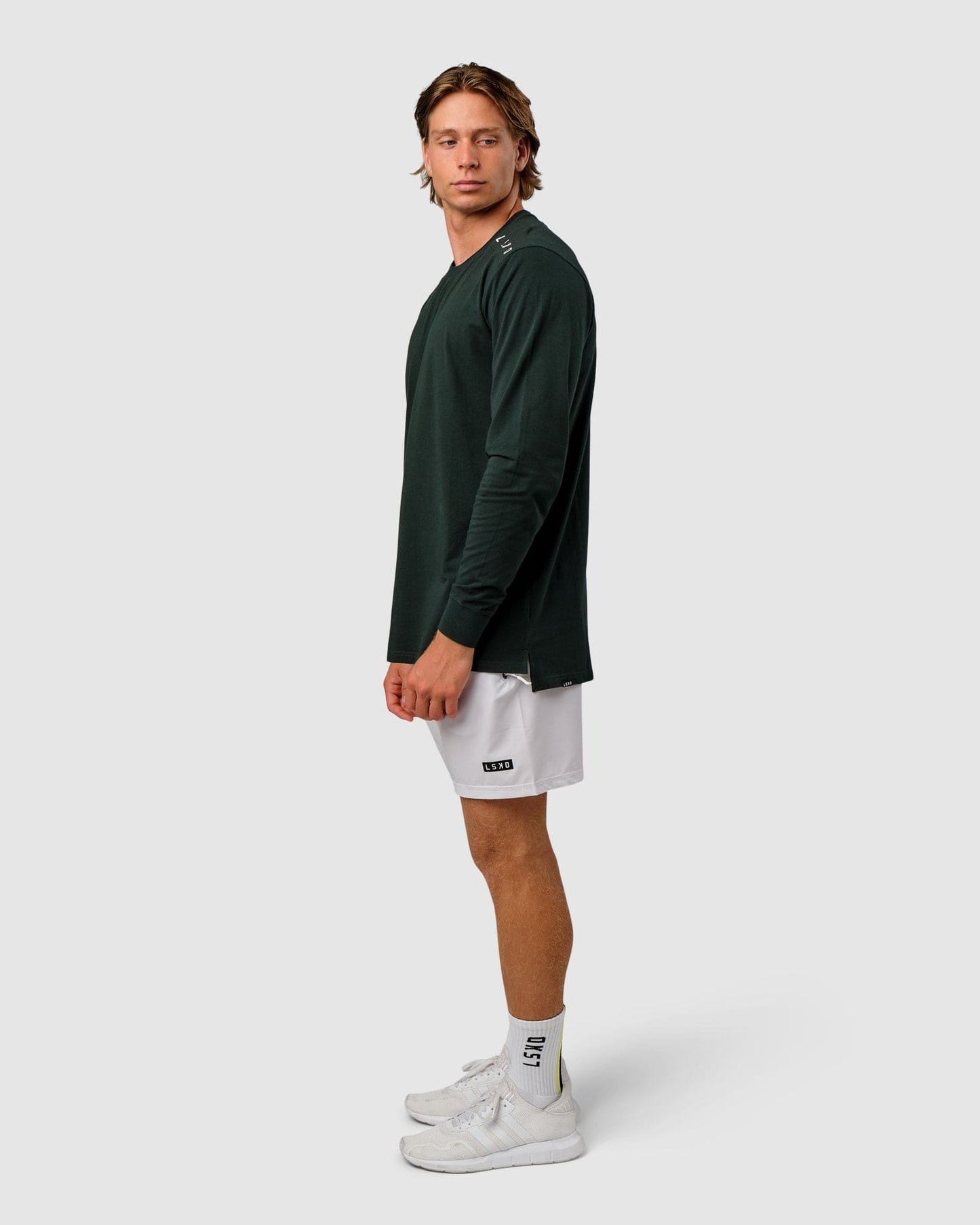 Model wearing Competitor LS Tee - Forest