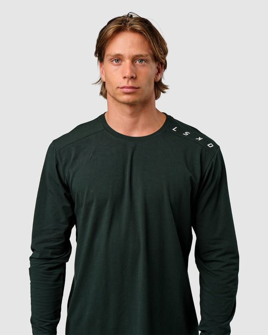 Model wearing Competitor LS Tee - Forest