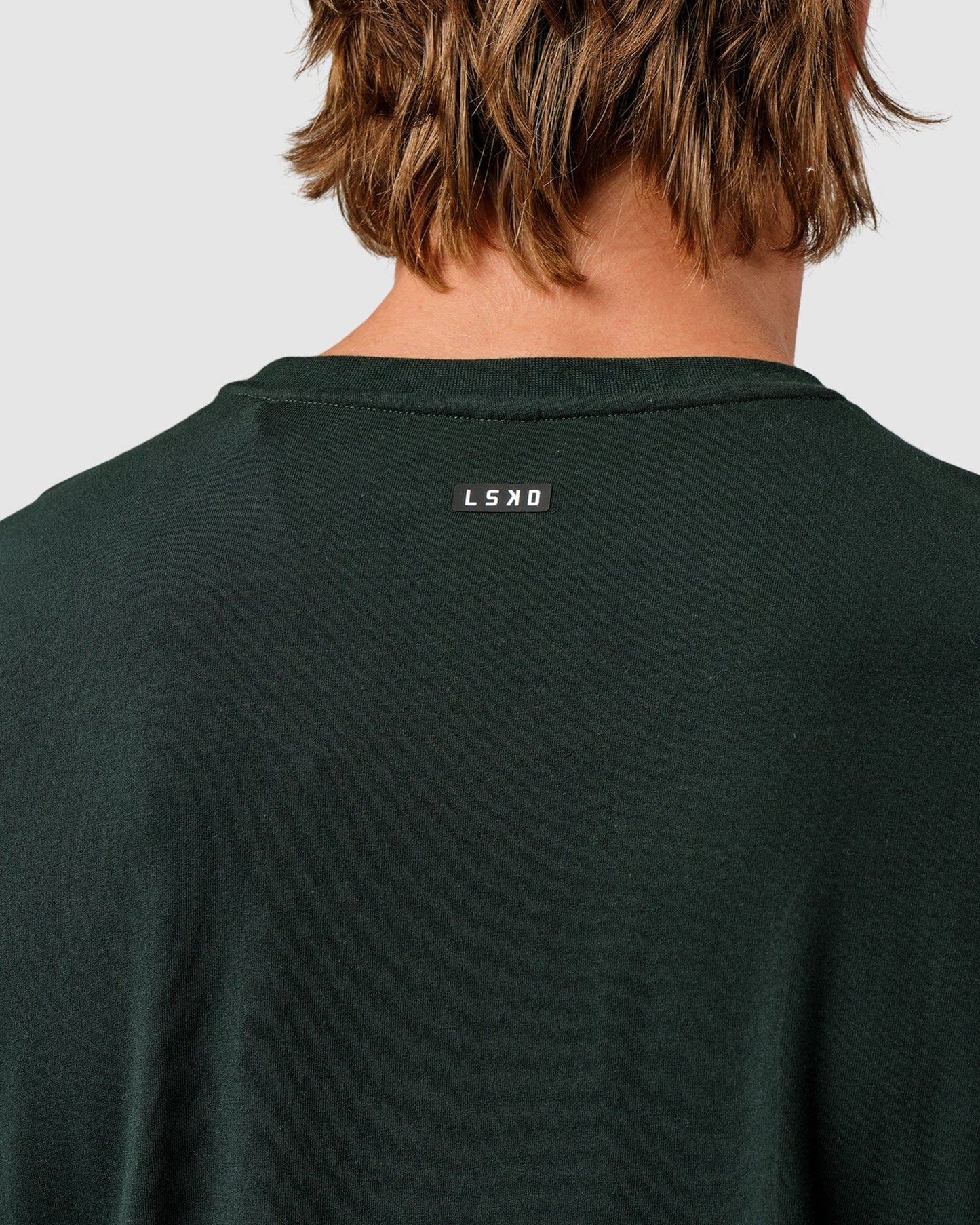 Model wearing Competitor LS Tee - Forest