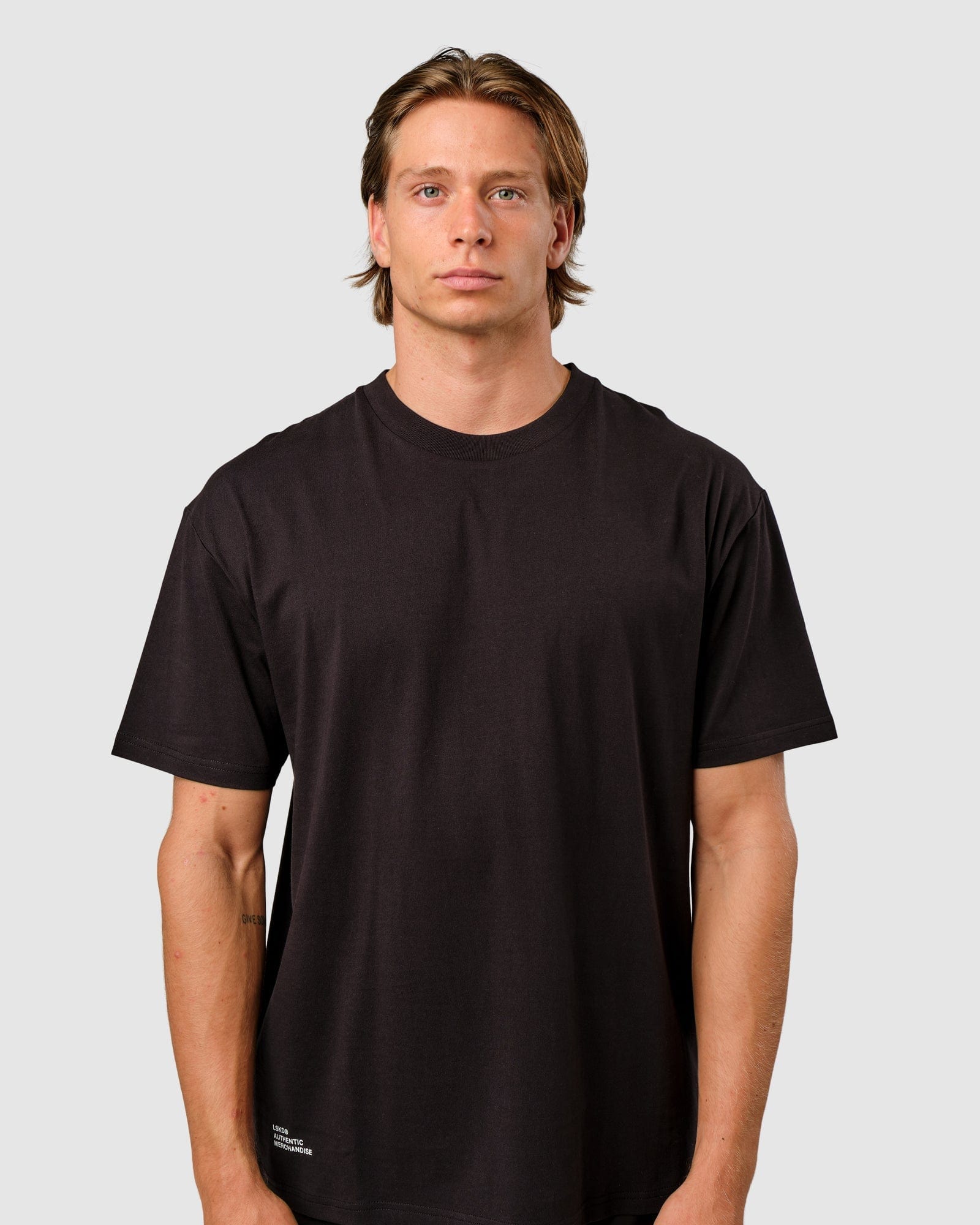 Model wearing OGTC Tee Oversize - Black