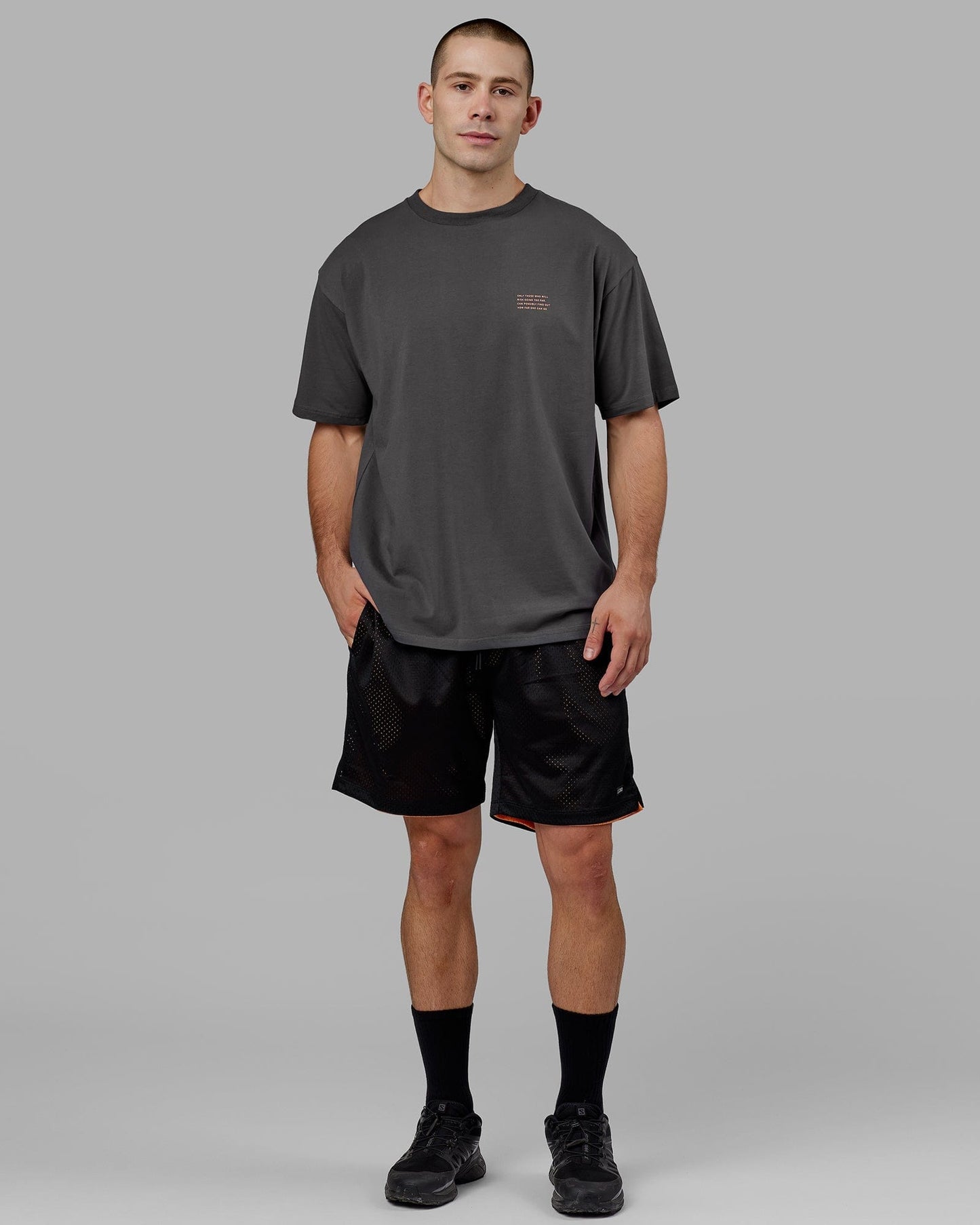 Model wearing Strive FLXCotton Tee Oversize - Asphalt-Tangerine