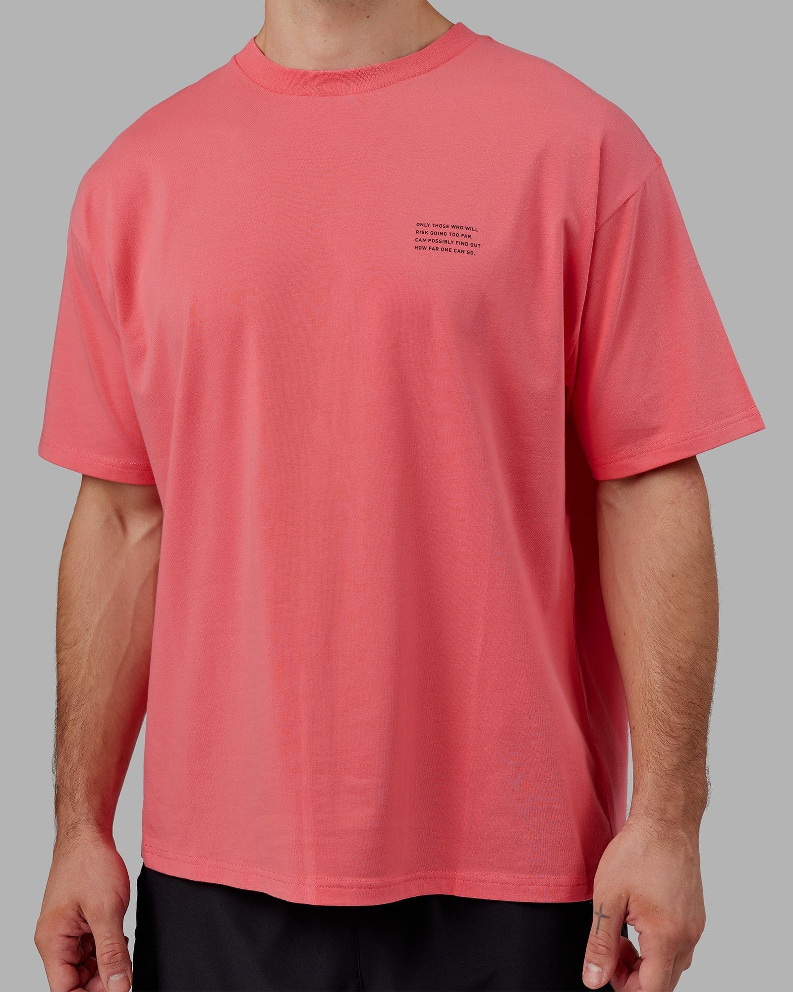 Model wearing Strive FLXCotton Tee Oversize - Sunkist Coral