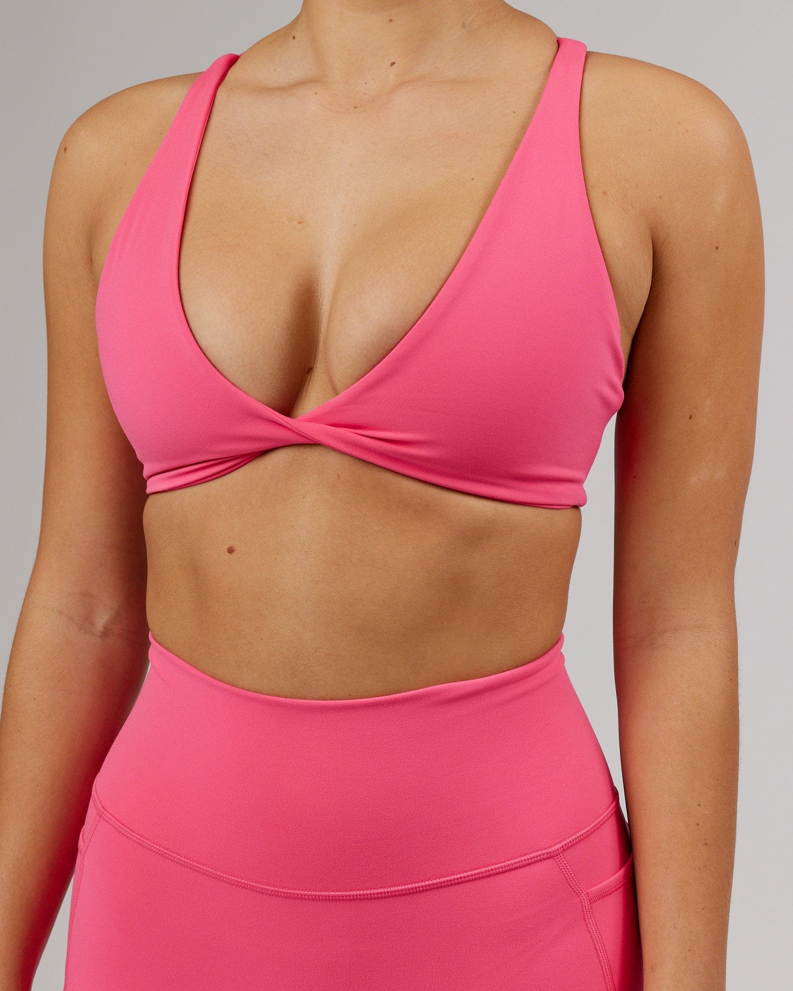 Model wearing Agile Sports Bra - Flamingo