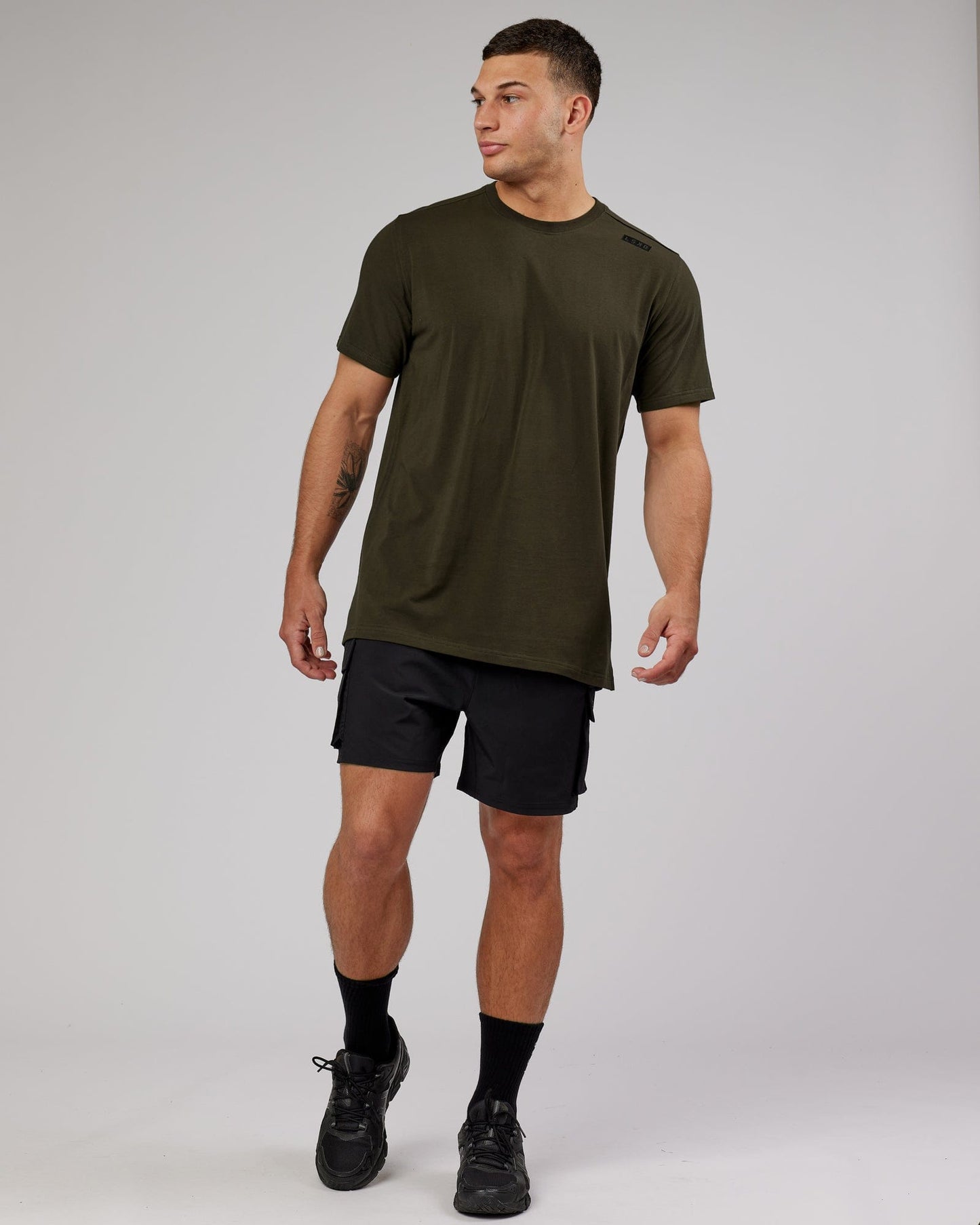 Model wearing Athlete FLXCotton Tee - Forest Night