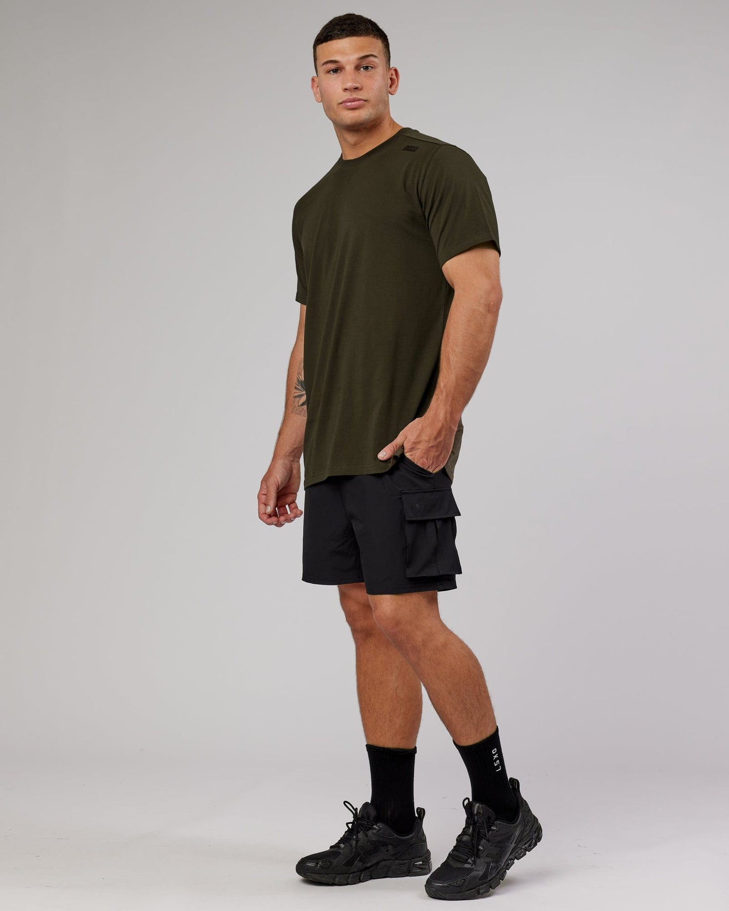 Model wearing Athlete FLXCotton Tee - Forest Night