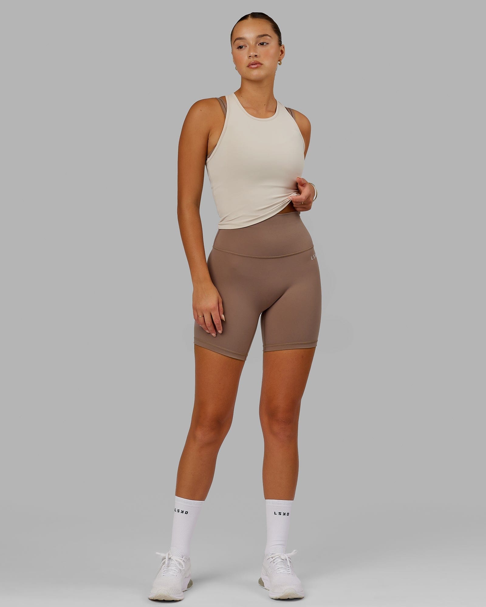 Model wearing Base 2.0 Mid Short Tight - Deep Taupe