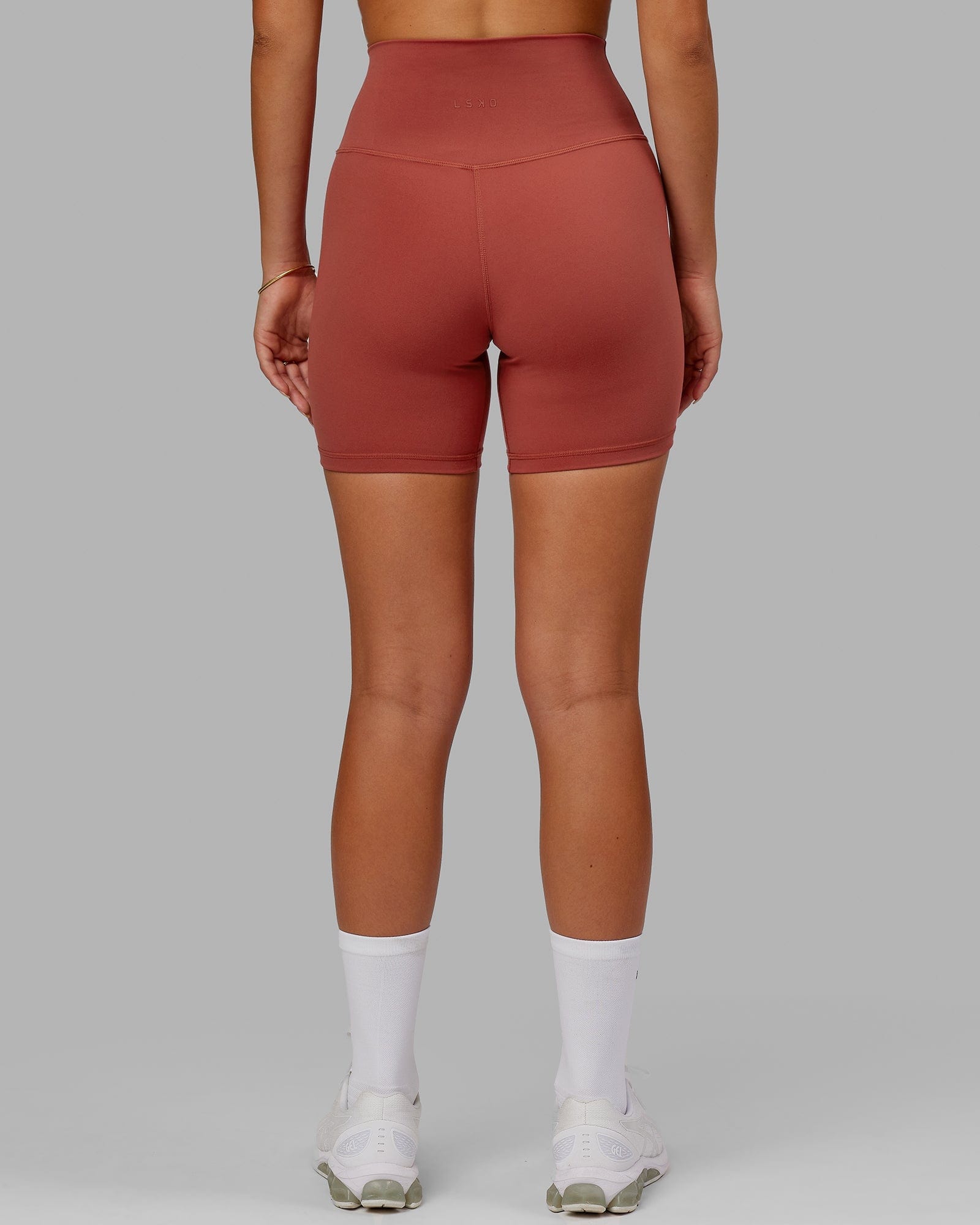 Model wearing Base 2.0 Mid Short Tight - Paprika