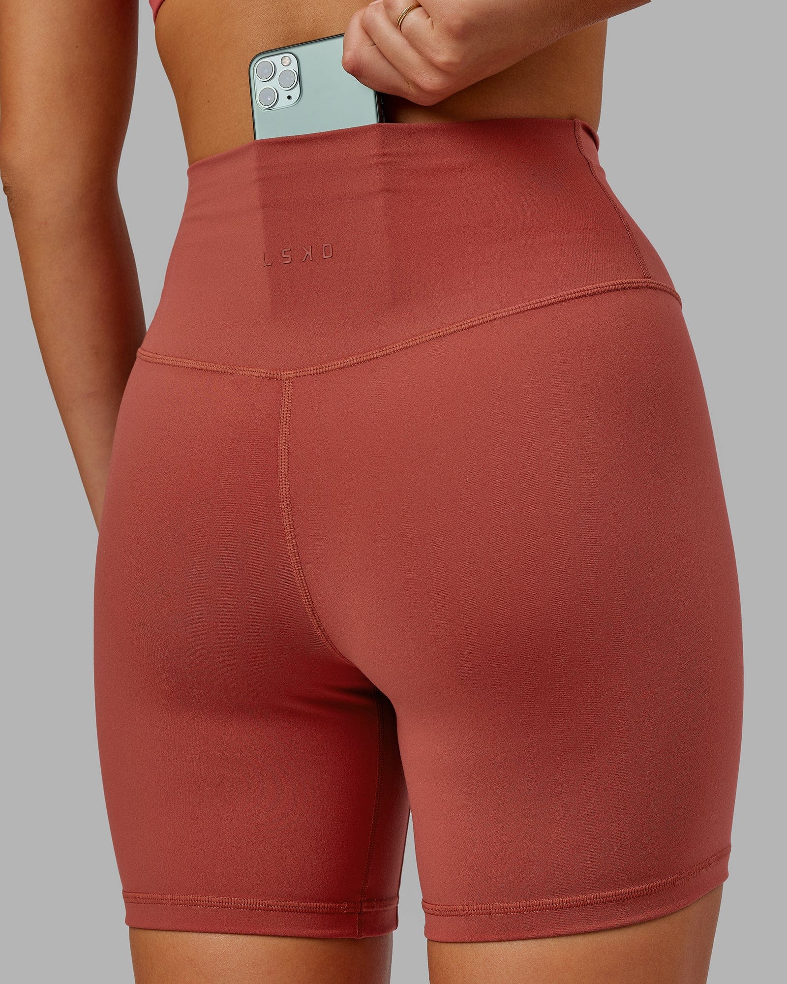 Model wearing Base 2.0 Mid Short Tight - Paprika