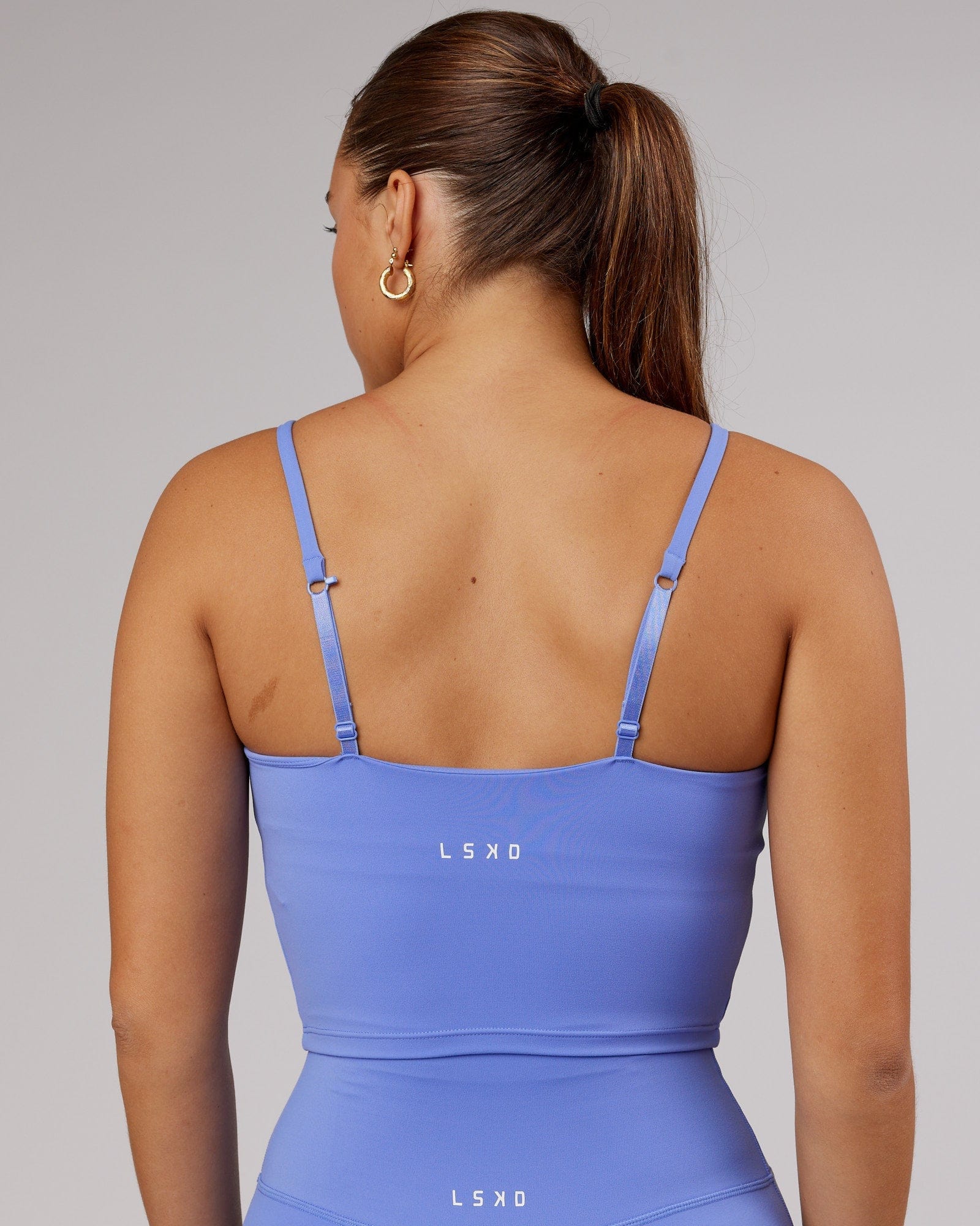 Model wearing Elixir Active Tank - Indulgent Blue