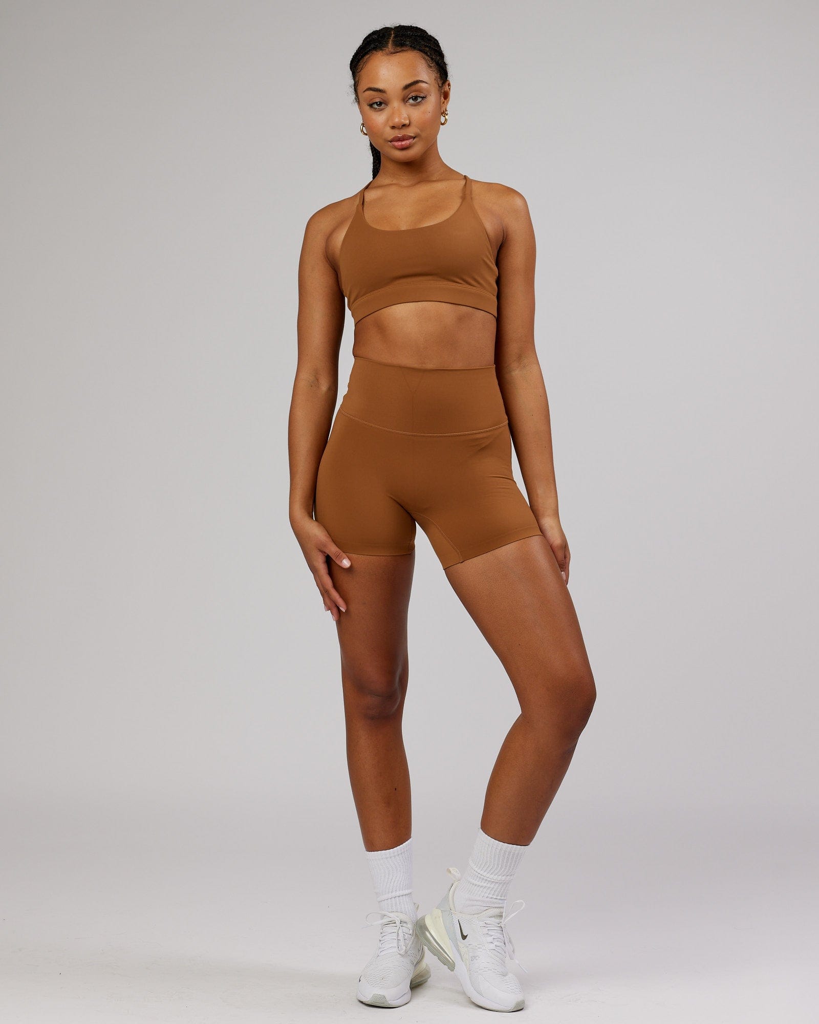 Model wearing Elixir Sports Bra - Camel
