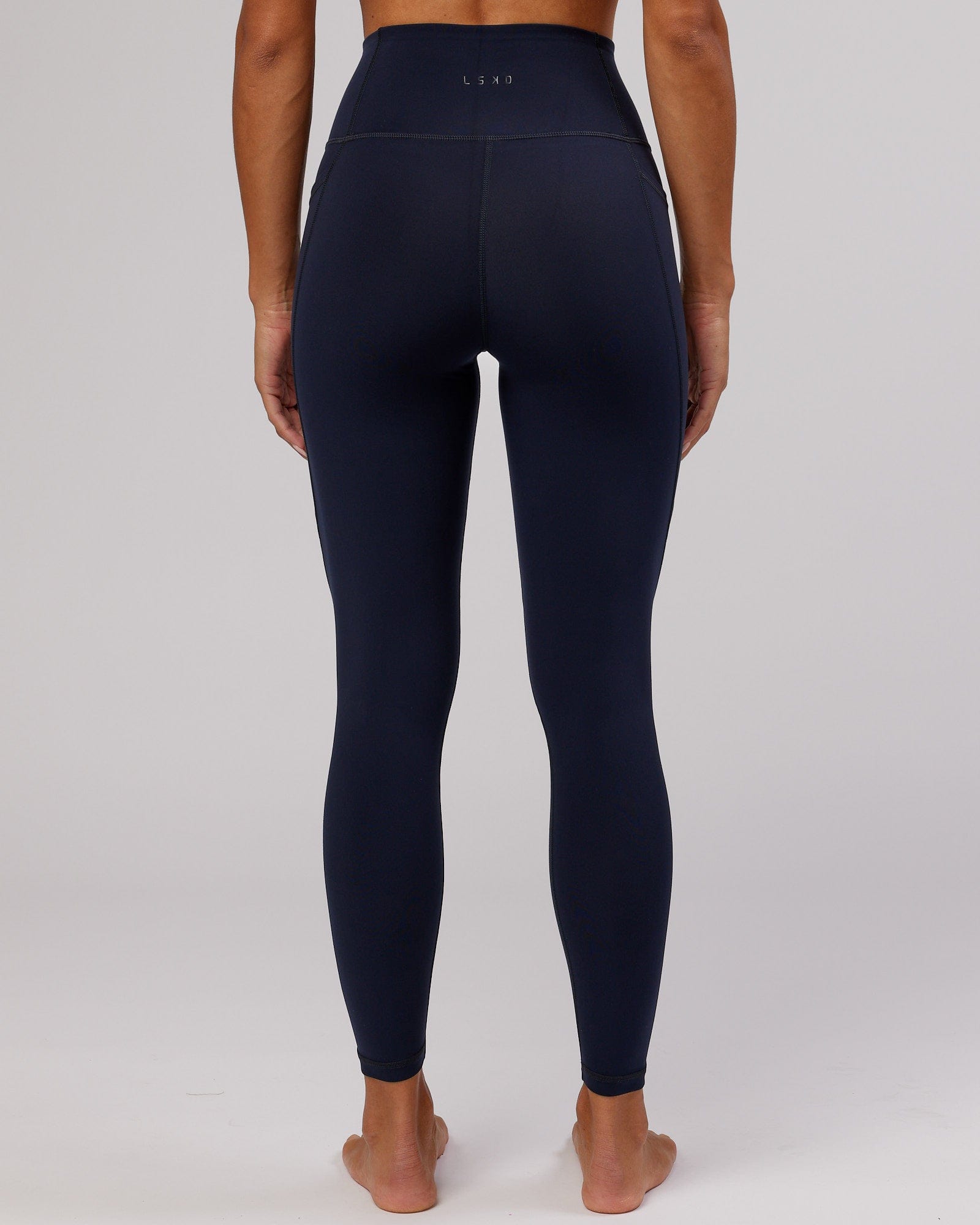 Model wearing Flux Full Length Tight - Navy