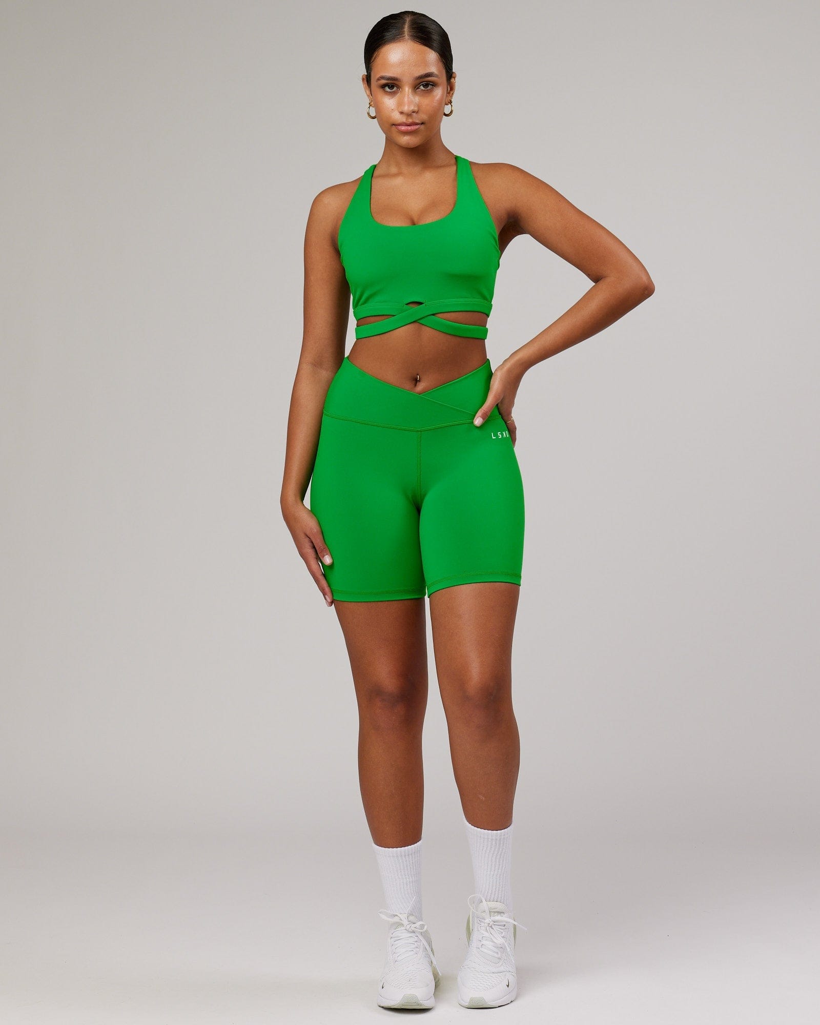 Model wearing Force Sports Bra - Vivid Green