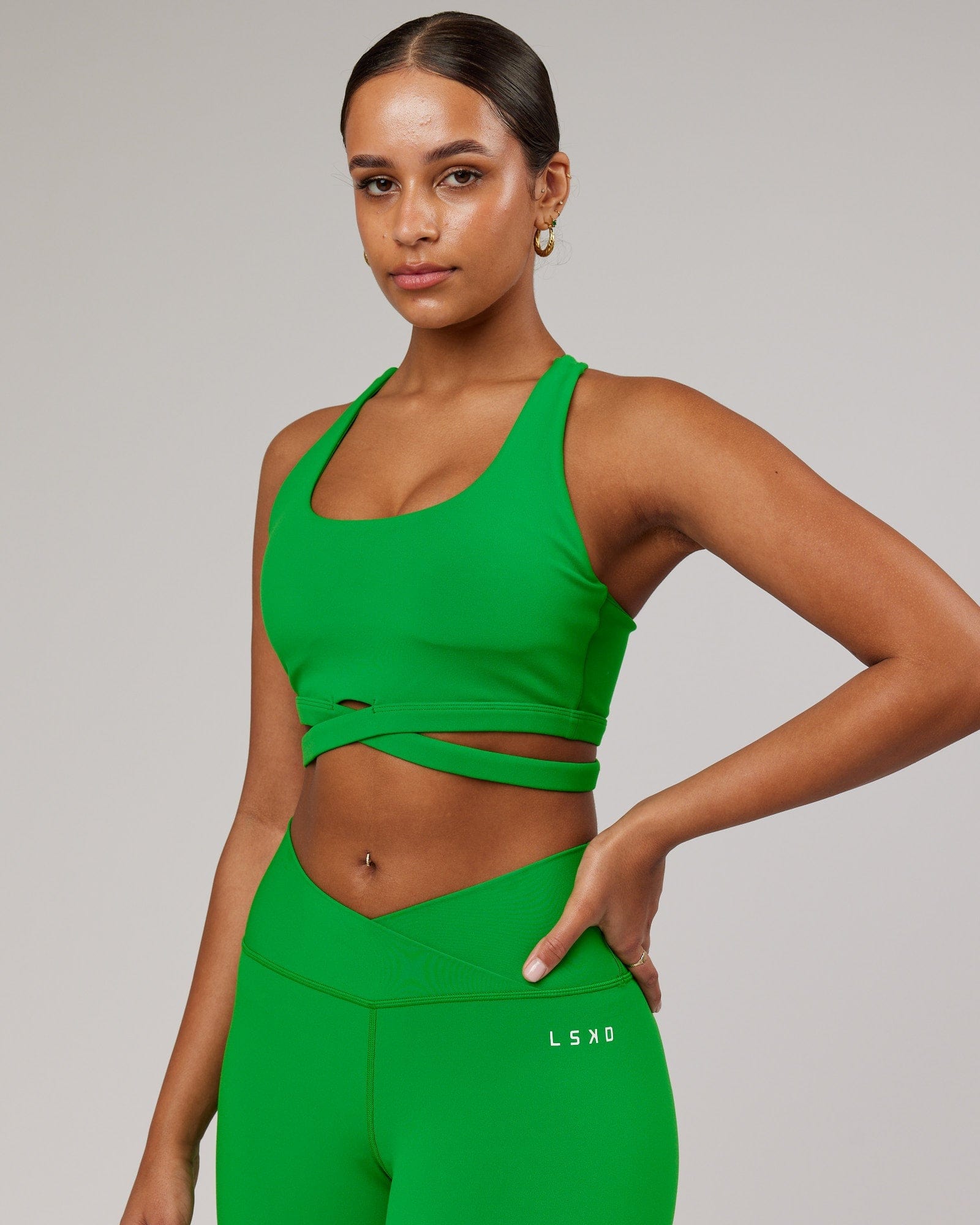 Model wearing Force Sports Bra - Vivid Green