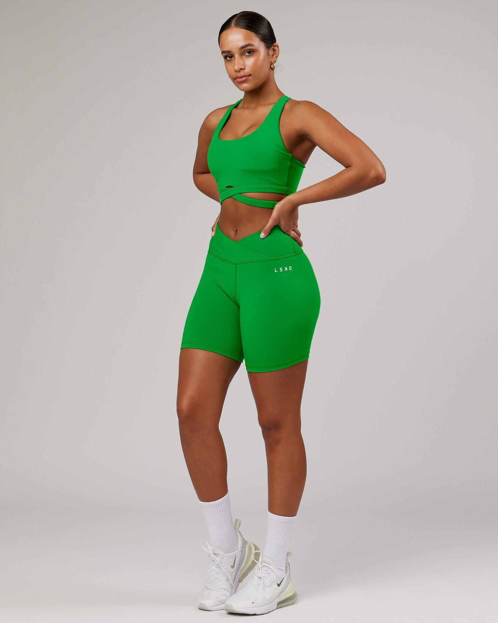 Model wearing Force Sports Bra - Vivid Green