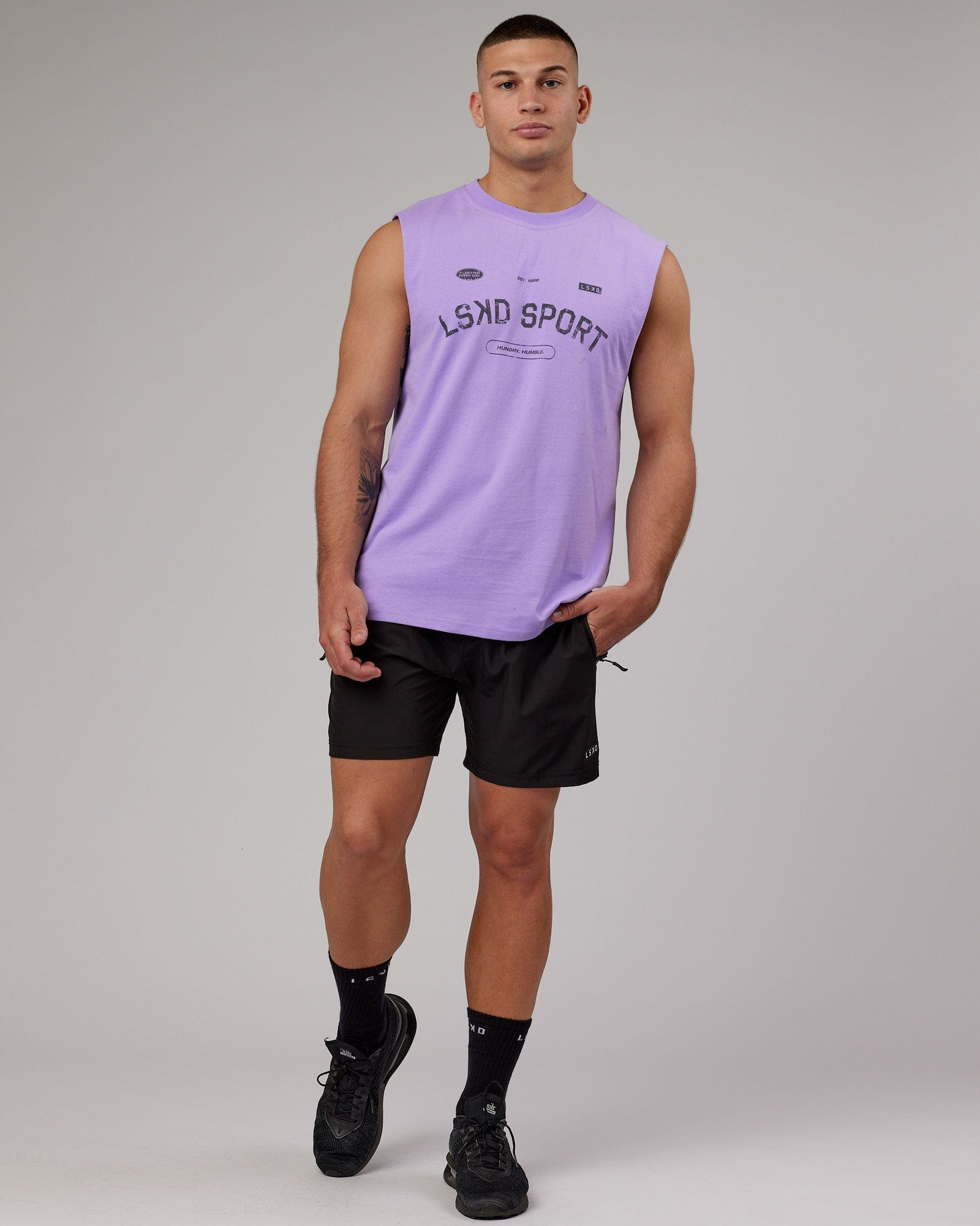 Model wearing Free Throw Heavyweight Tank Oversize - Peak Purple