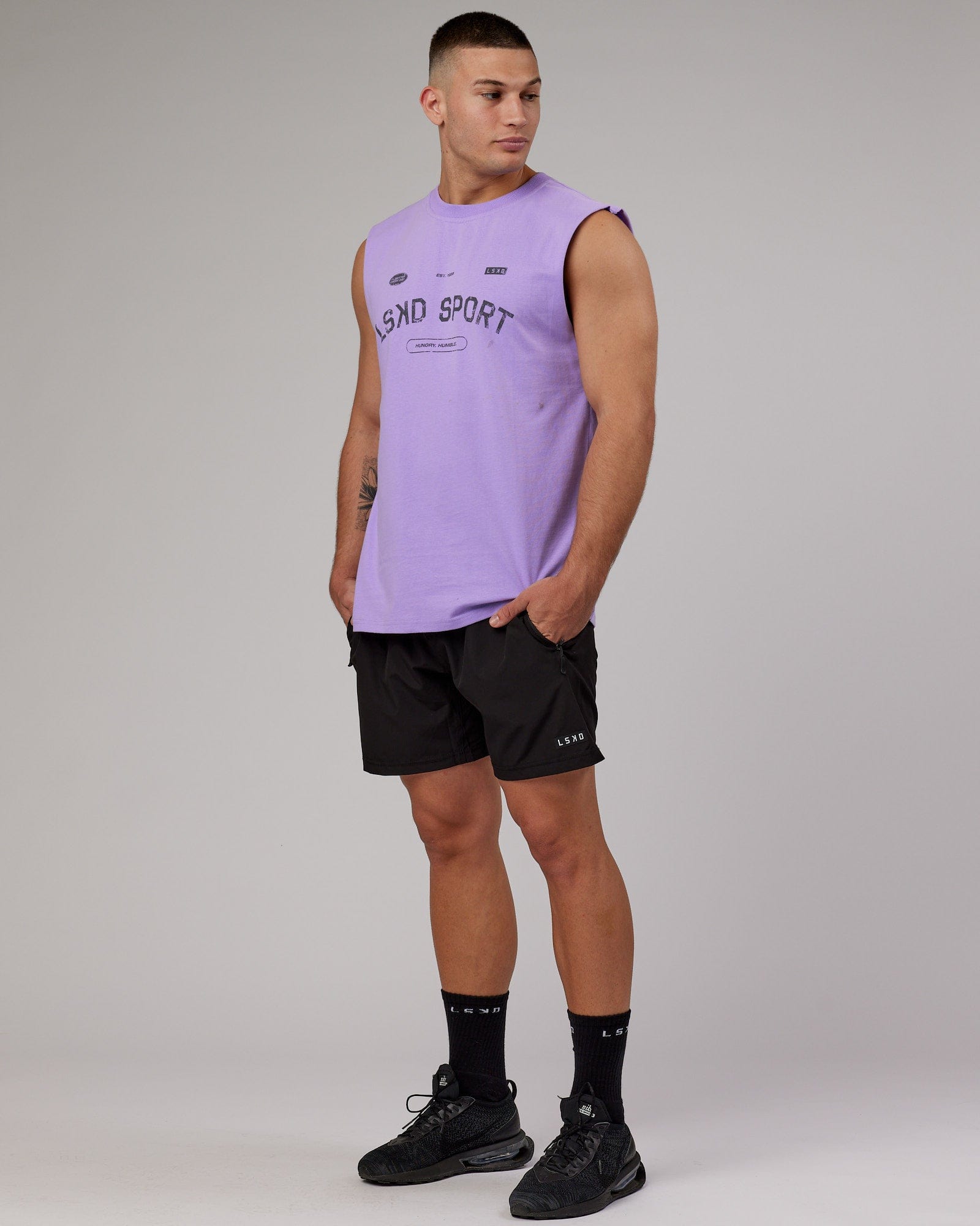 Model wearing Free Throw Heavyweight Tank Oversize - Peak Purple