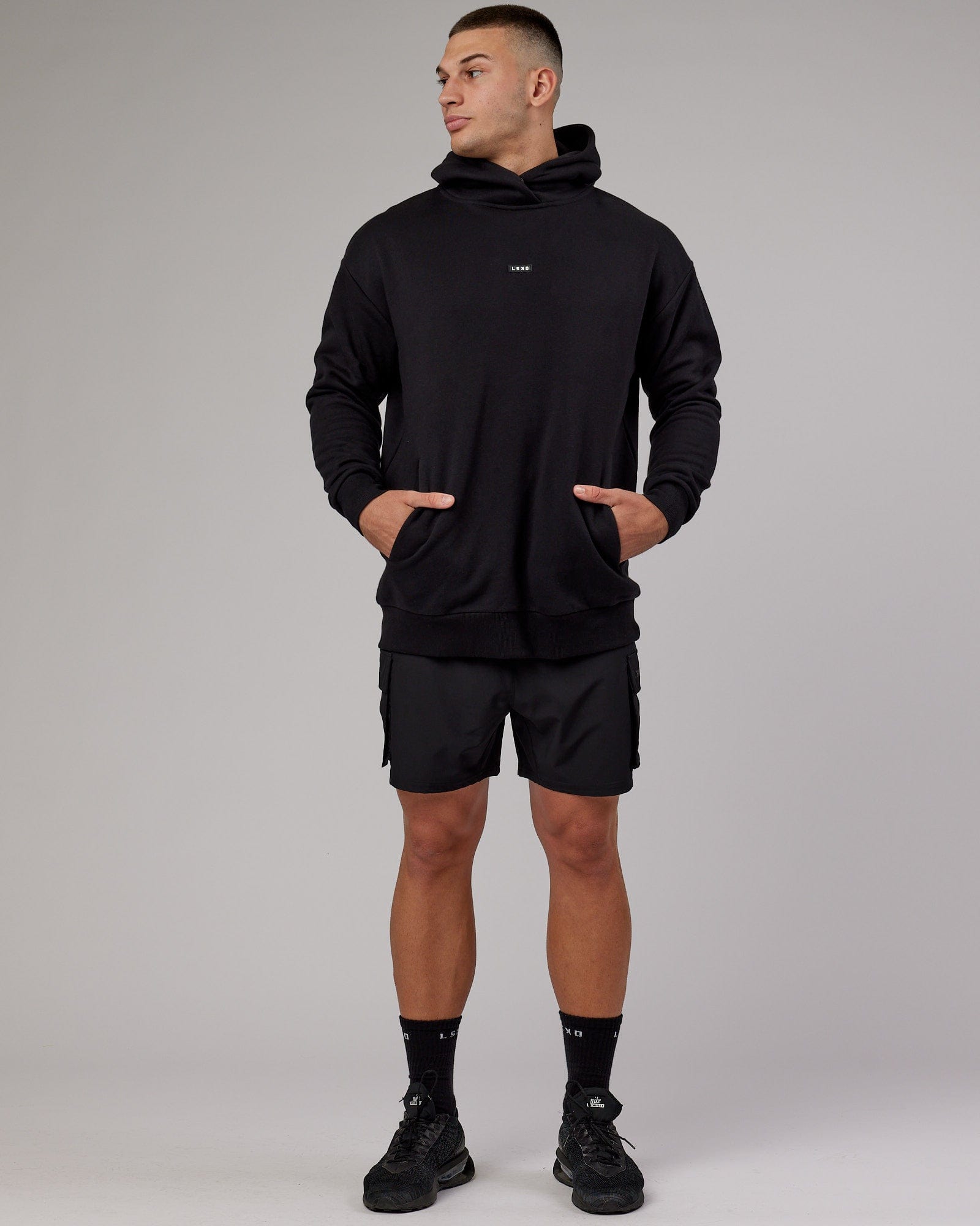 Model wearing Fundamental Hoodie Oversize - Black