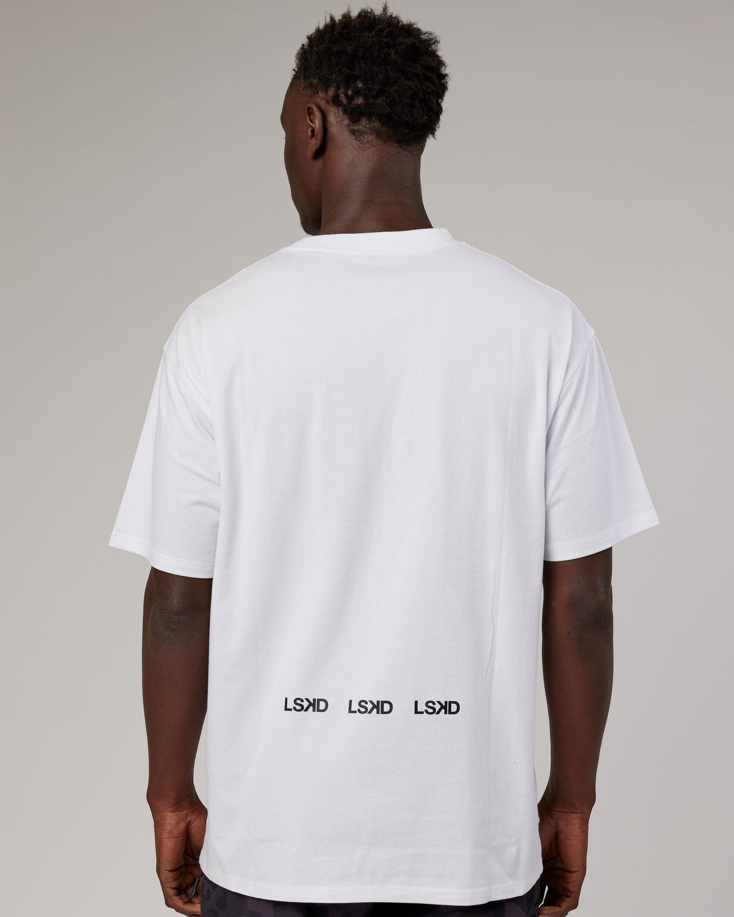 Model wearing DownLow FLXCotton Oversize Tee - White