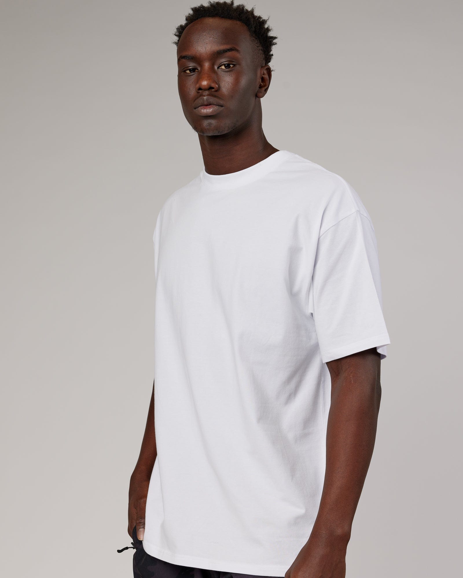 Model wearing DownLow FLXCotton Oversize Tee - White