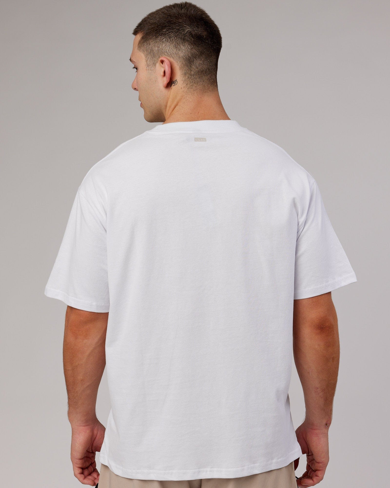 Model wearing Heritage Heavyweight Tee Oversize - White-Black-Oak