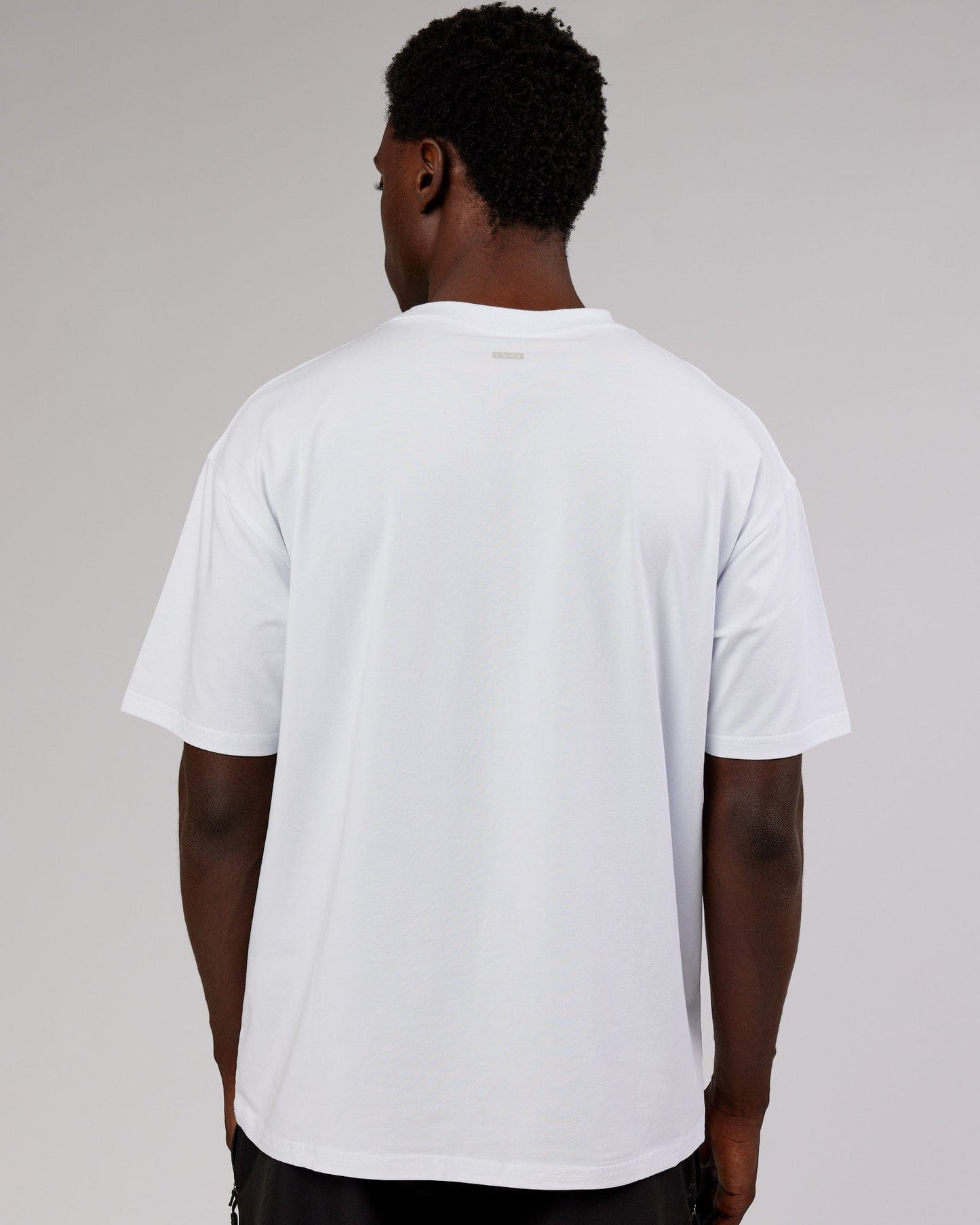 Model wearing Iconic FLXCotton Tee Oversize - White-Pink