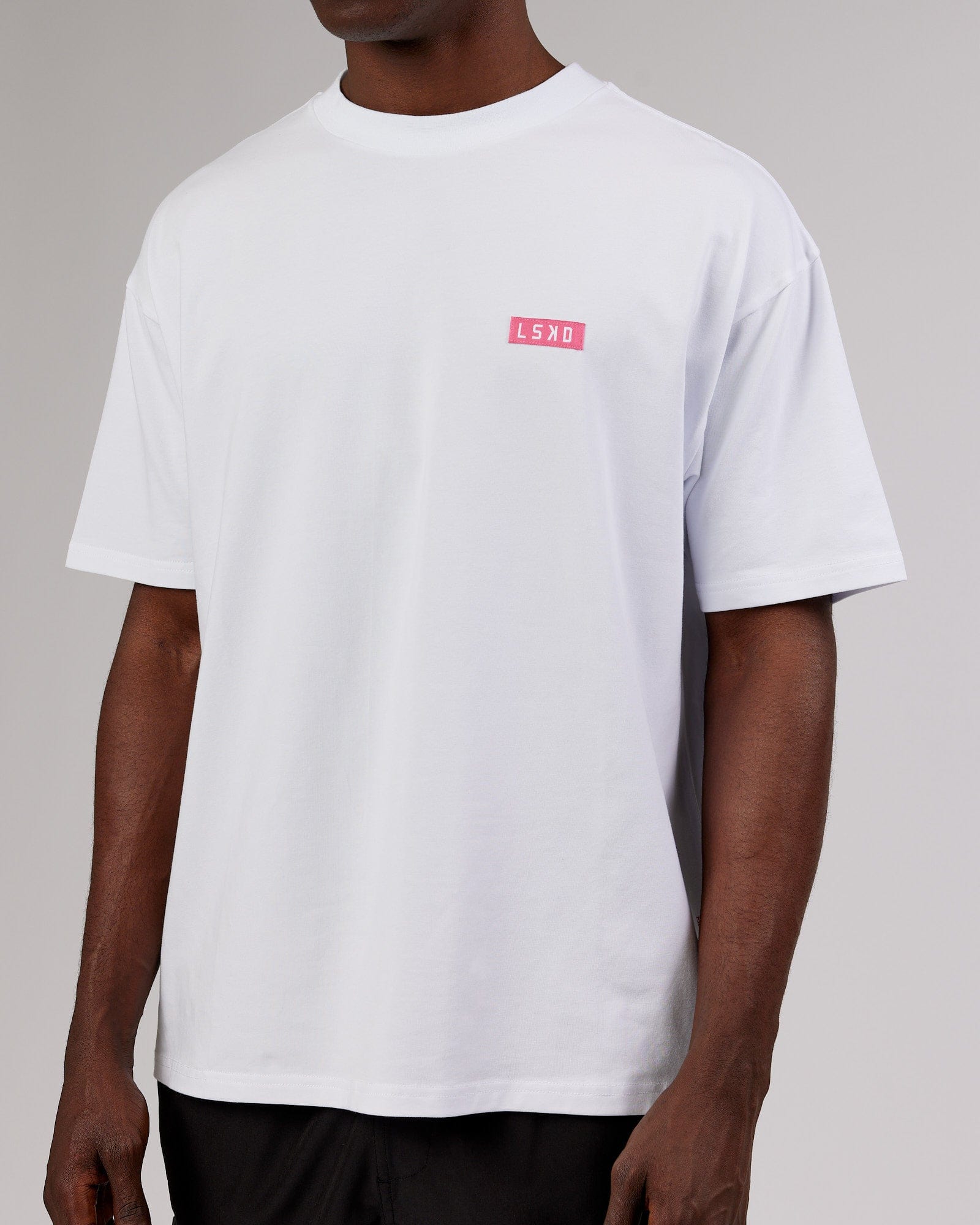 Model wearing Iconic FLXCotton Tee Oversize - White-Pink