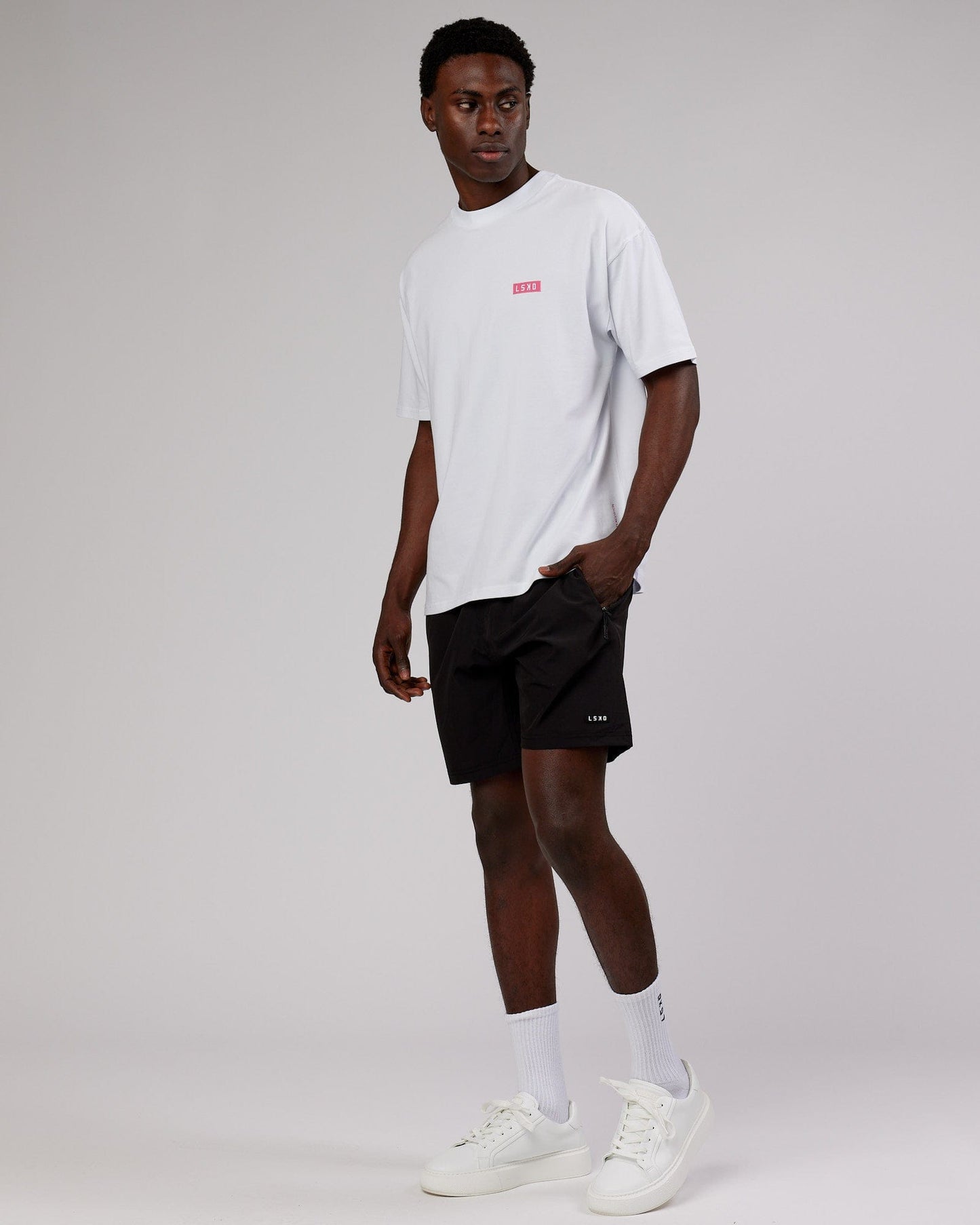 Model wearing Iconic FLXCotton Tee Oversize - White-Pink