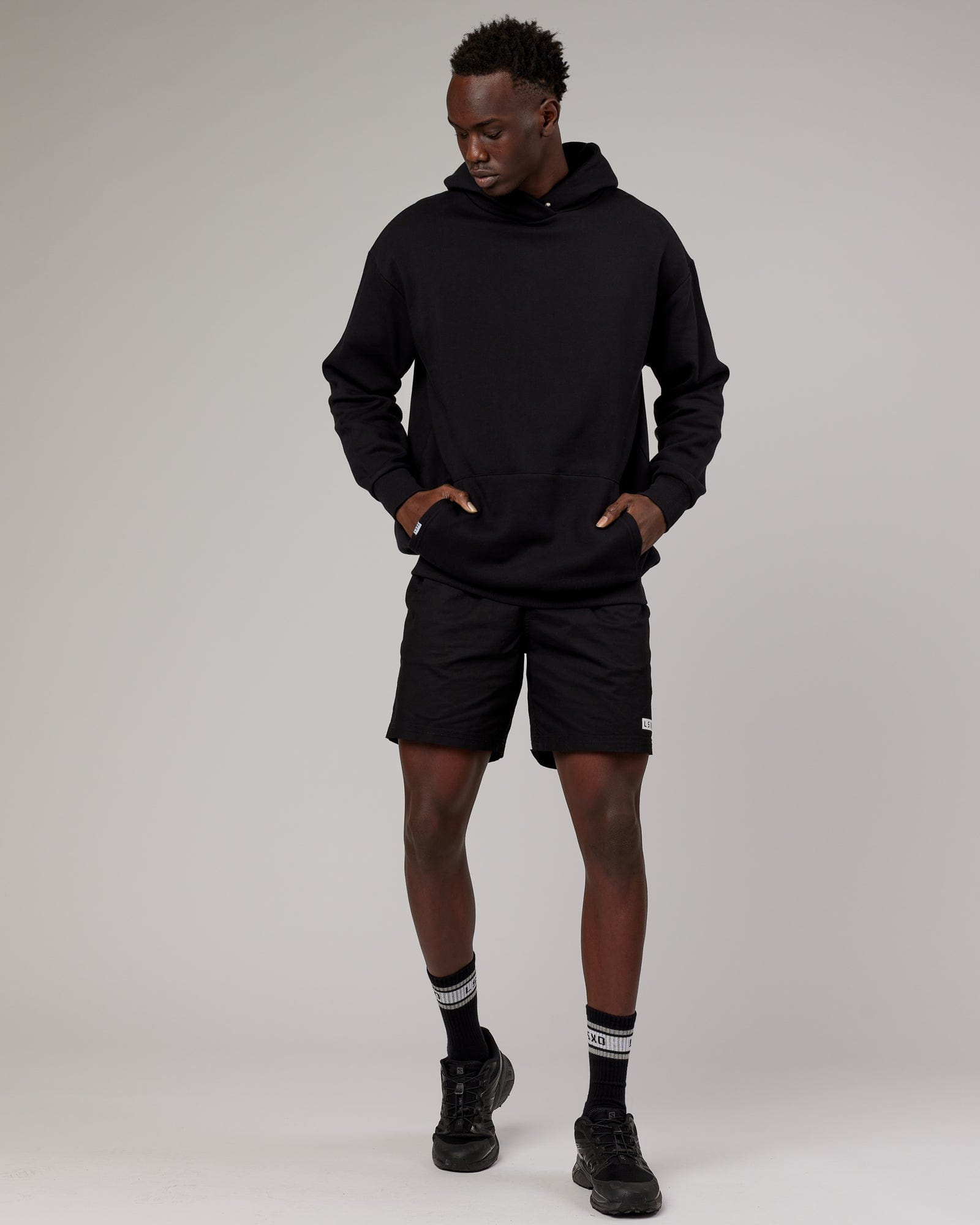 Model wearing Linear Hoodie Oversize - Black
