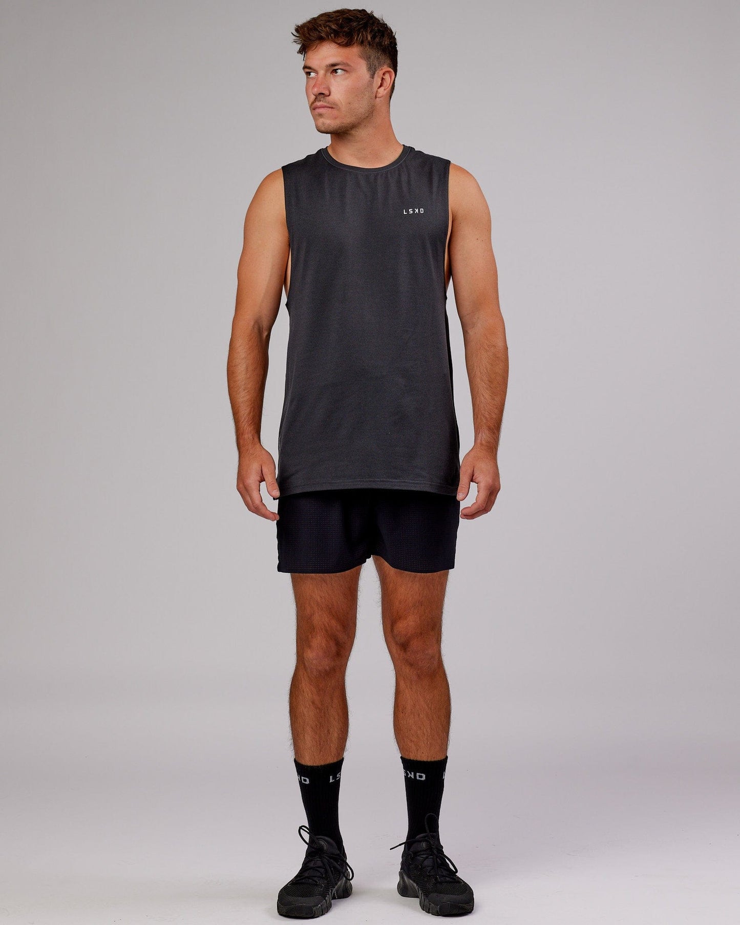 Model wearing Perform VapourFLX Muscle Tank - Black Marl
