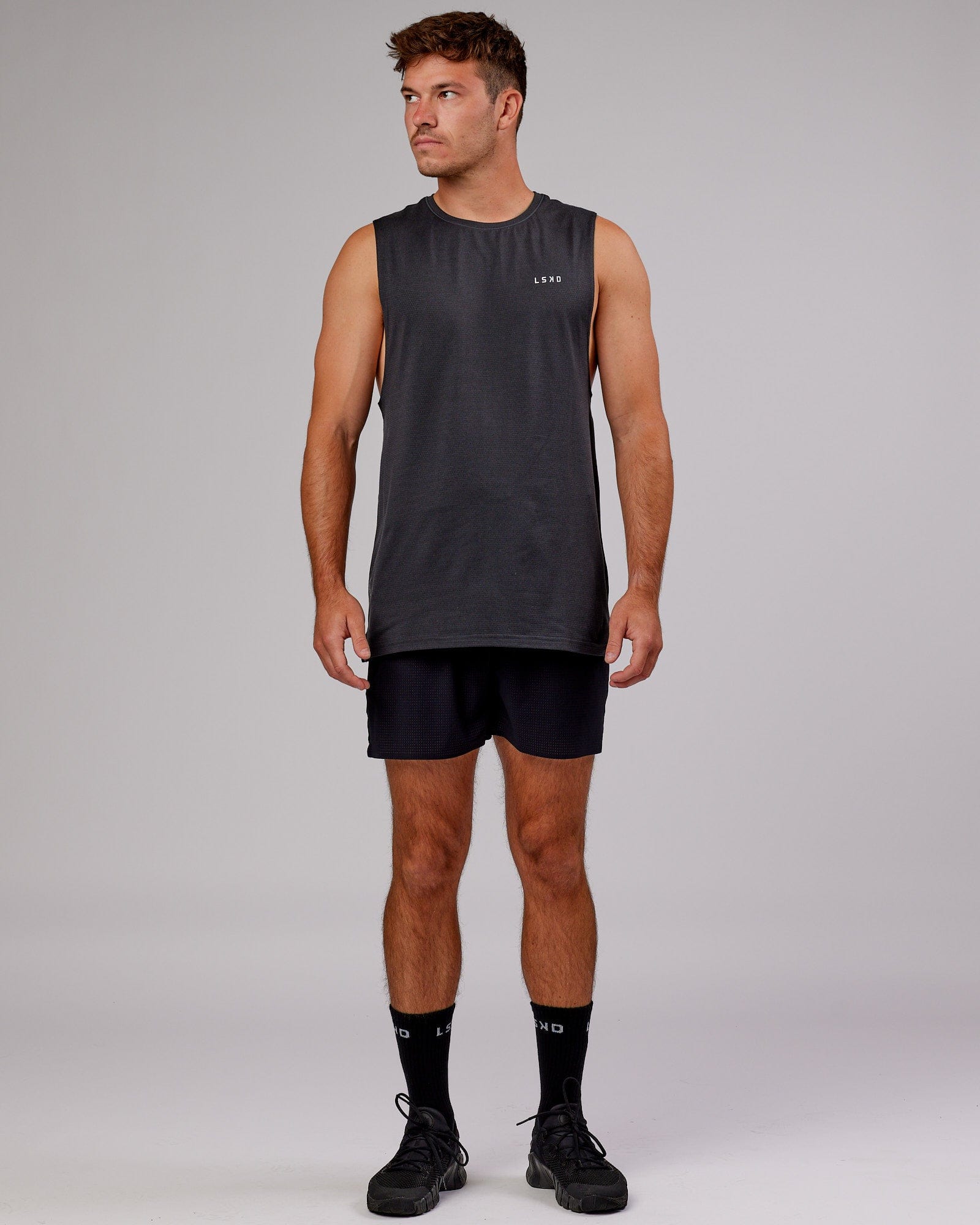 Model wearing Perform VapourFLX Muscle Tank - Black Marl
