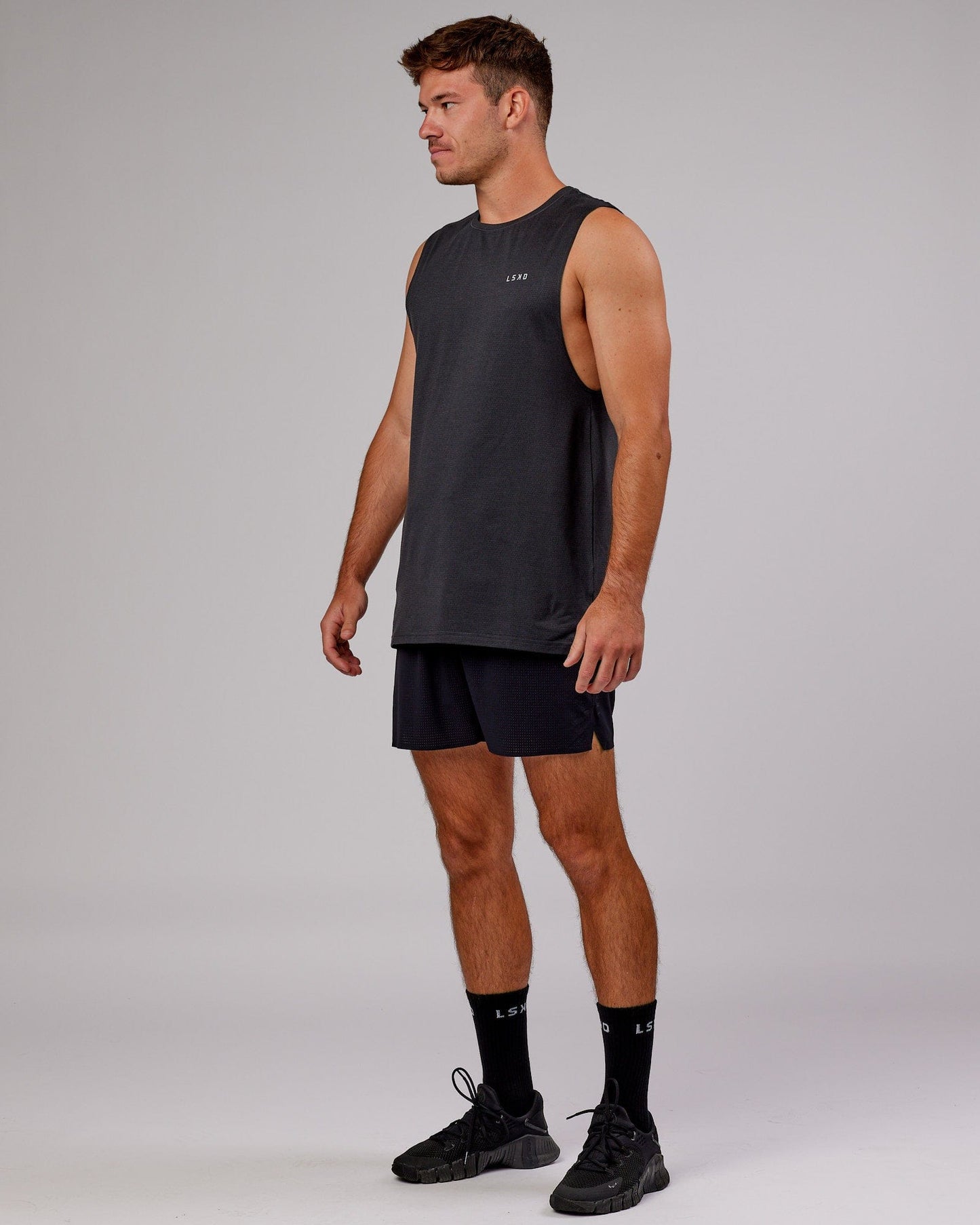 Model wearing Perform VapourFLX Muscle Tank - Black Marl