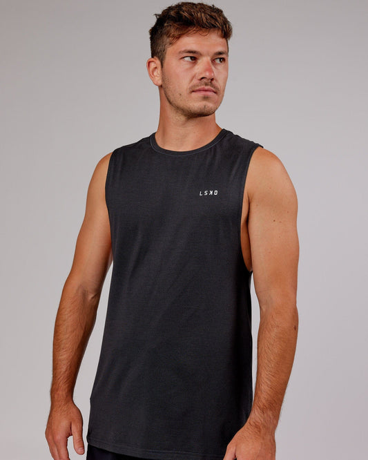Model wearing Perform VapourFLX Muscle Tank - Black Marl