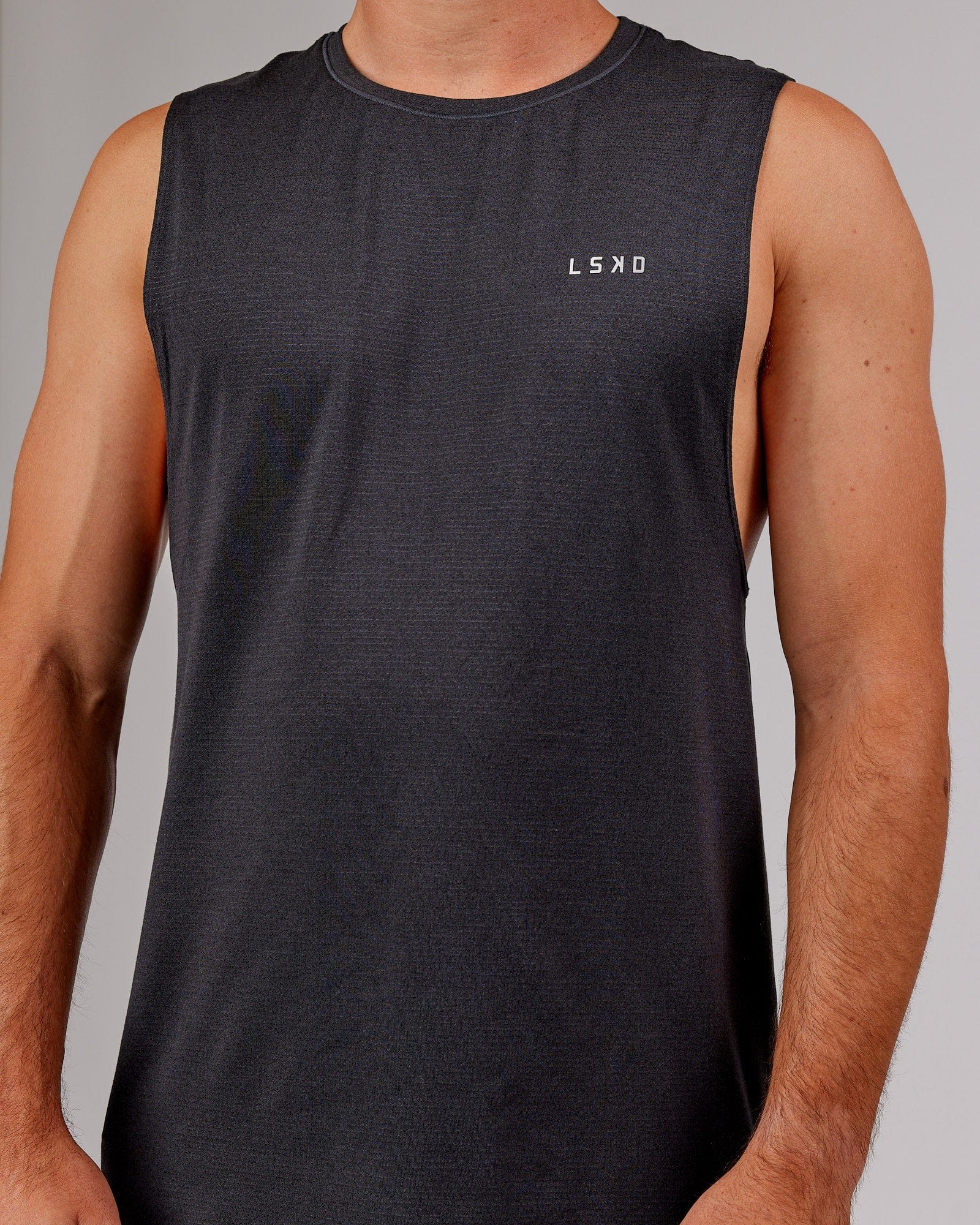 Model wearing Perform VapourFLX Muscle Tank - Black Marl