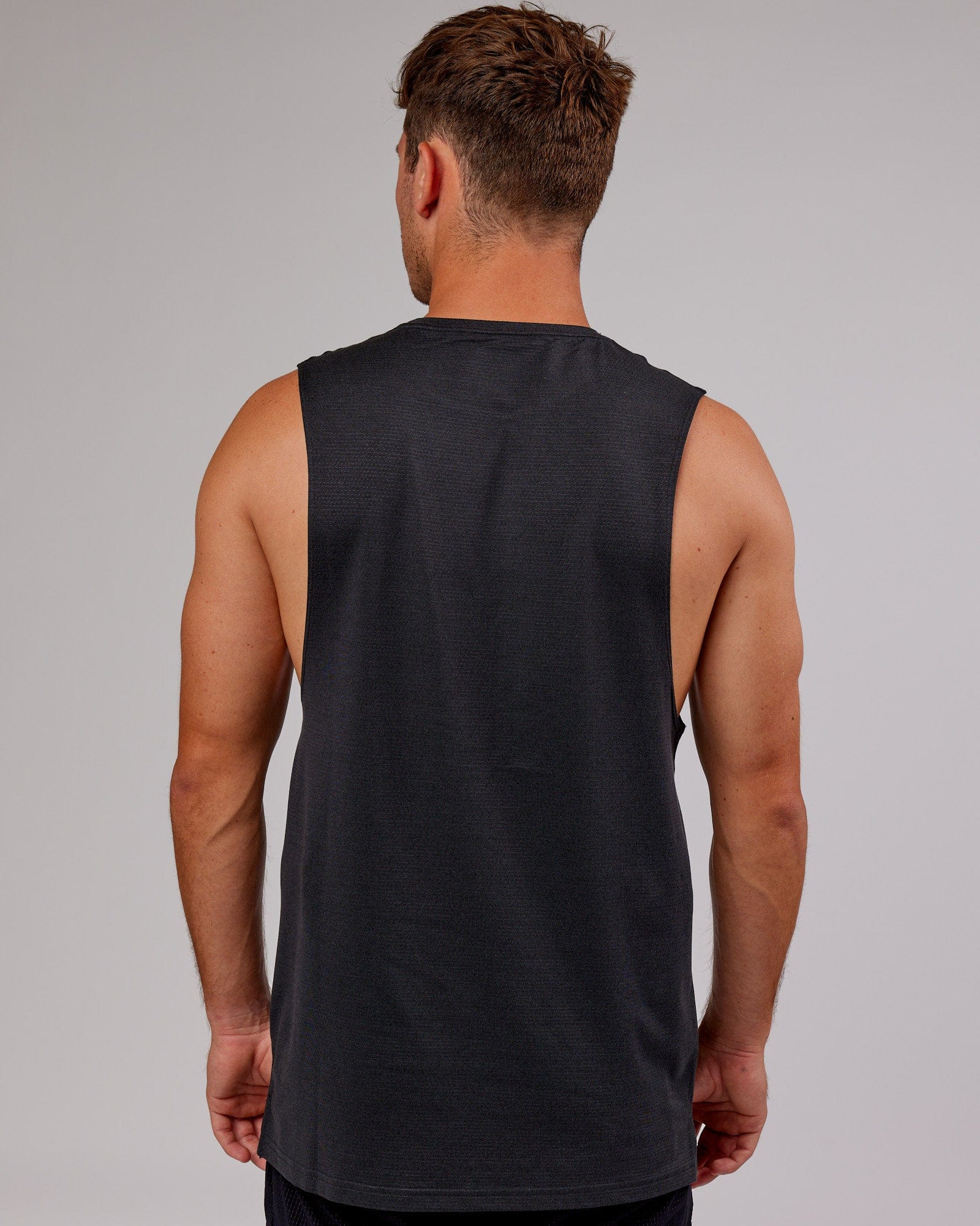 Model wearing Perform VapourFLX Muscle Tank - Black Marl